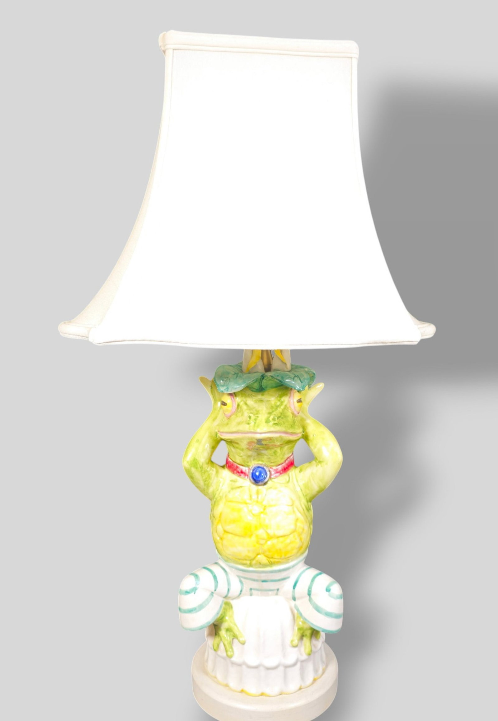 Paul Hansen Porcelain Frog Table Lamp: Paul Hansen Porcelain Frog Table Lamp. New York, 1960s. Porcelain, lacquered wood and brass. 7 1/4w x 7d x 28 3/8h.