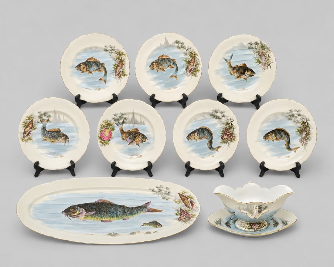 Austrian Porcelain Hand Painted Porcelain Fish Set: Austrian Porcelain Hand Painted Porcelain Fish Set. Circa 1920s. 9 piece set consisting of platter, sauce boat and 7 plates. All with gilt borders. Marked Austria to underside. Platter 25 1/4 x 10