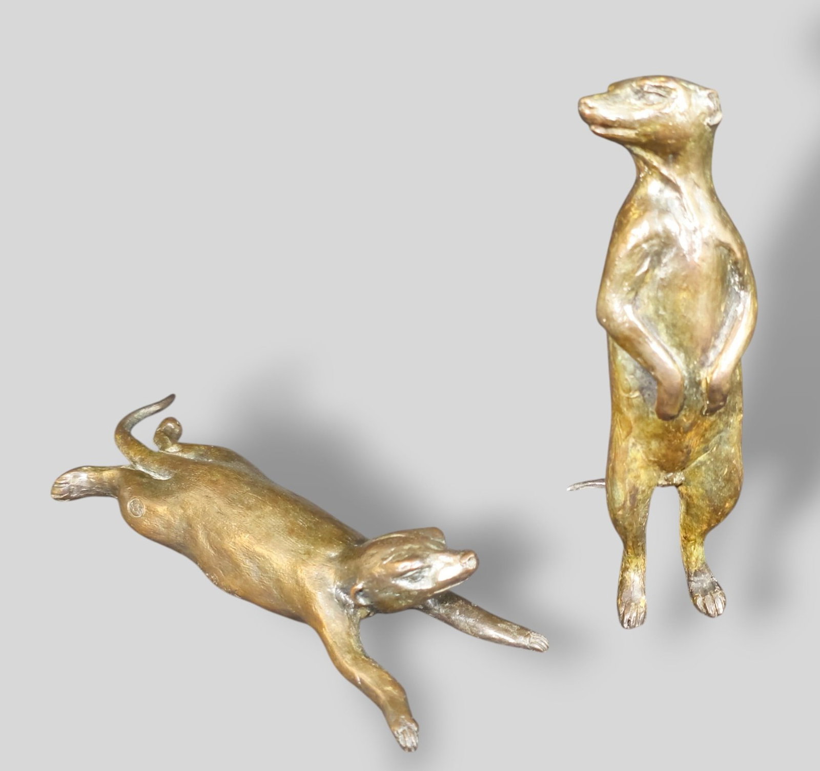 Donald Greig Bronze Meerkats: Donald Greig Bronze Meerkats. Two different forms. Each signed. 3w x 1 1/4d x 5 1/2h. 7w x 2 1/2d x 1 1/2h.