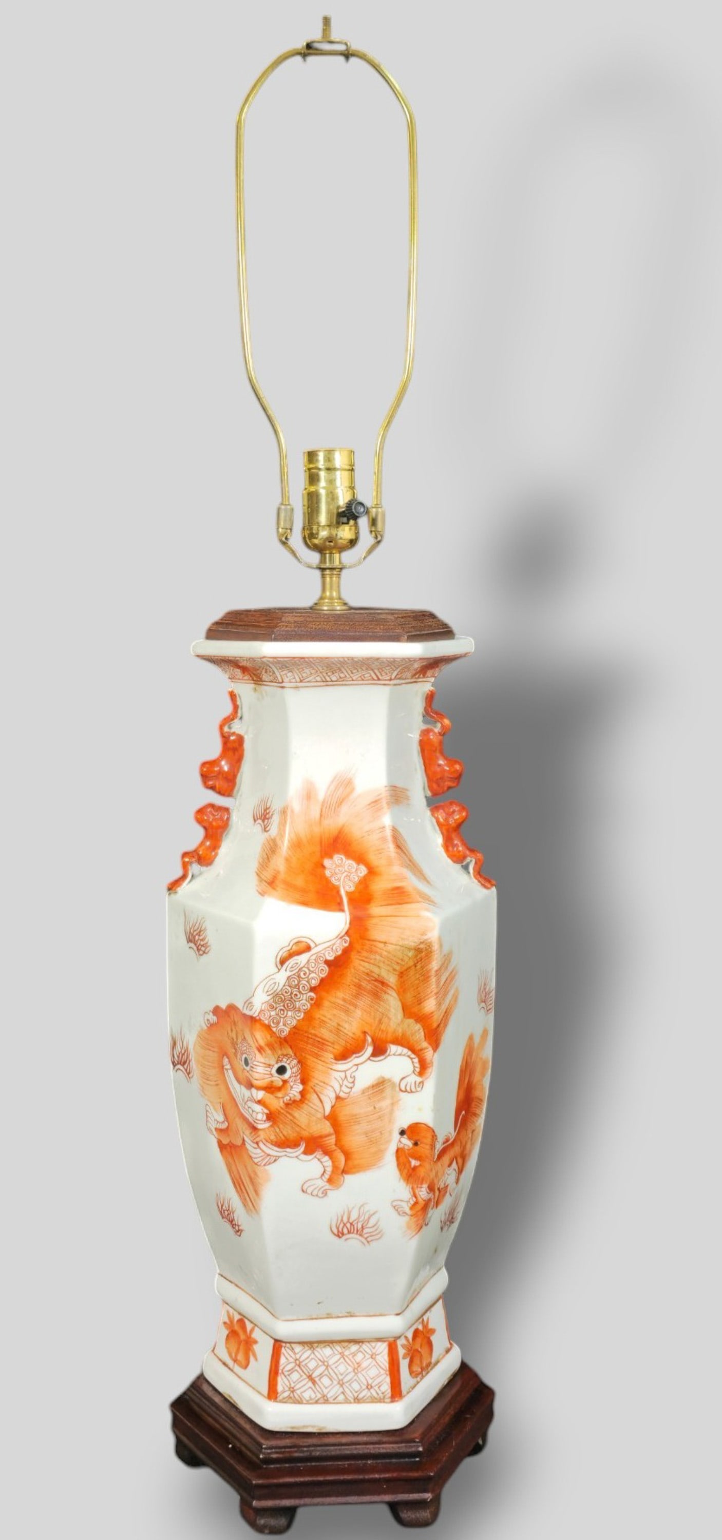 Late 19th Early 20th Century Qing Chinese Porcelain Table Lamp: Late 19th Early 20th Century Qing Chinese Porcelain Table Lamp. Octagonal form vase converted to a lamp. Decorated with foo dogs, flowers and calligraphy. Foo dog handles. Vase 8w x 8d x 17h. Overall