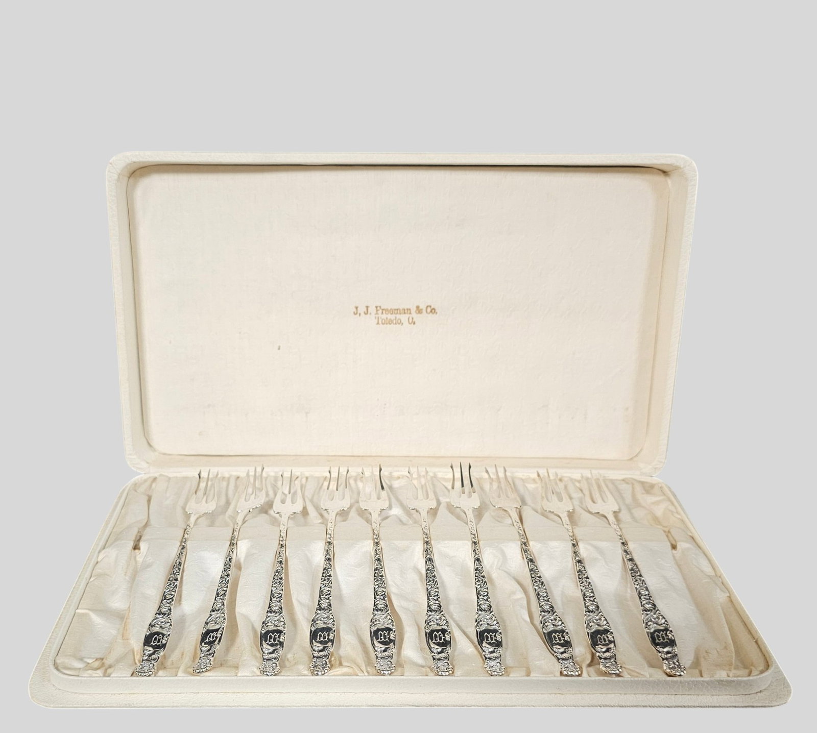 Whiting Heraldic Sterling Silver Cocktail Forks: Whiting Heraldic Sterling Silver Cocktail Forks. Set of 10. Original fitted case. Manufacturer's mark to underside of fork. Fork 6 1/4 long. Case 13w x 7 1/2d x 1 1/4h. Weight 3.87 ozt