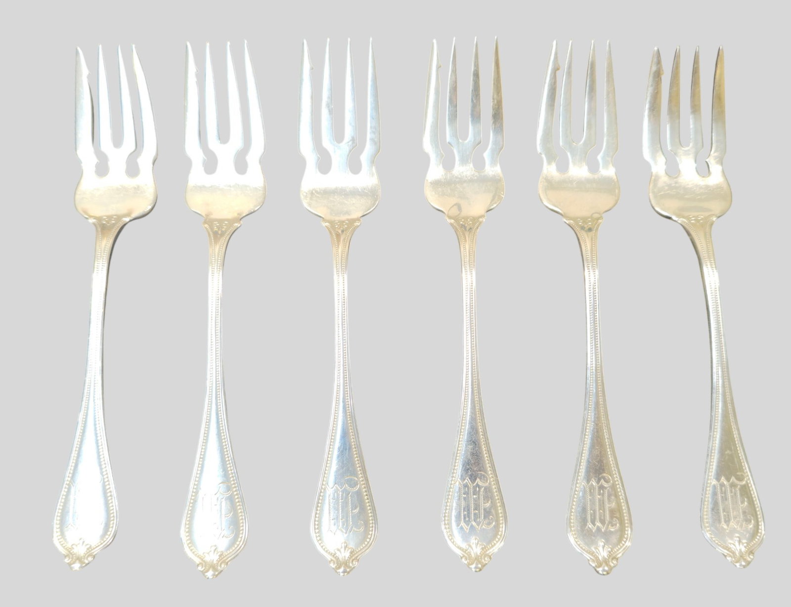Towle Paul Revere Sterling Silver Salad Forks: Towle Paul Revere Sterling Silver Salad Forks. Set of 6. Beaded borders and scrolled shell ends. Manufacturer's mark and sterling to underside. 6 1/4 long. Weight 7.535 ozt