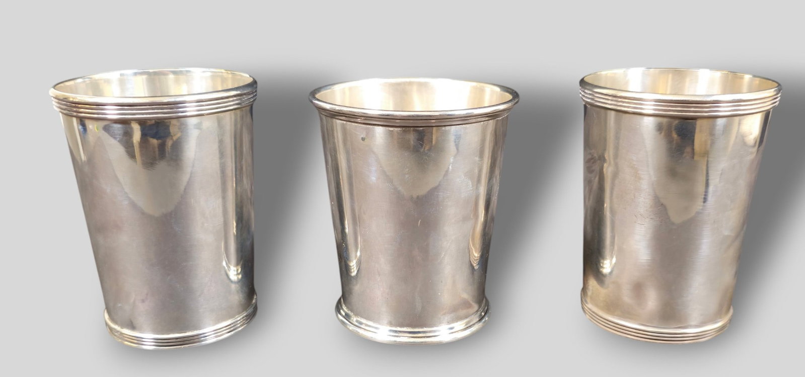 Assembled Sterling Silver Mint Julep Cups: Assembled Sterling Silver Mint Julep Cups. 3 total. Two are Boardman. Ribbed rim and base. Marked to underside, sterling and #85. 2 7/8dia x 4h. S Kirk and Son Sterling silver mint julep cup. Marked
