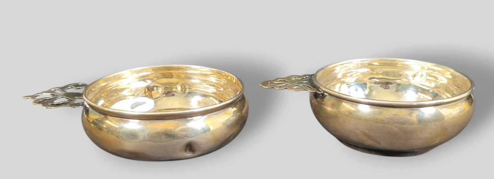Baldwin And Miller Sterling Silver Nappes: Baldwin And Miller Sterling Silver Nappes. Pair. Open work handles. Manufacturer's mark, #4 and sterling to underside. 4 1/8w x 5 3/8d x 1 7/8h. Weight 5.28ozt.
