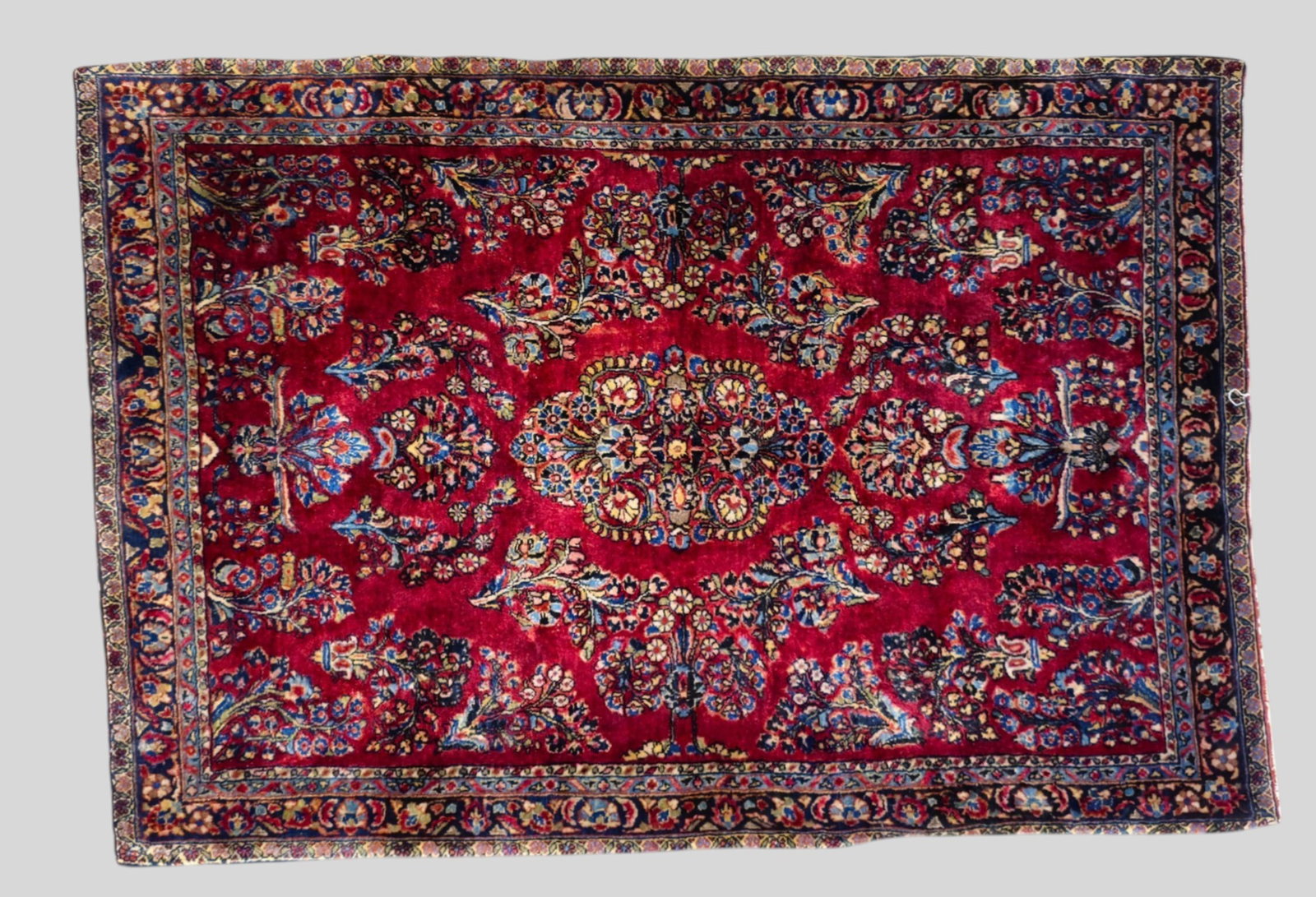 Sarouk Area Rug: Sarouk Area Rug 1930s. All over garden design over a red field. 3ft 3 1/2in x 4ft 8in.