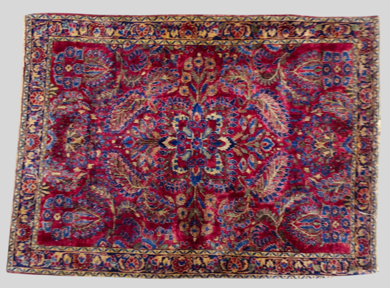 Sarouk Area Rug: Sarouk Area Rug 1960s. All over garden design over a red field. 3ft 5 1/4in x 4ft 8in.