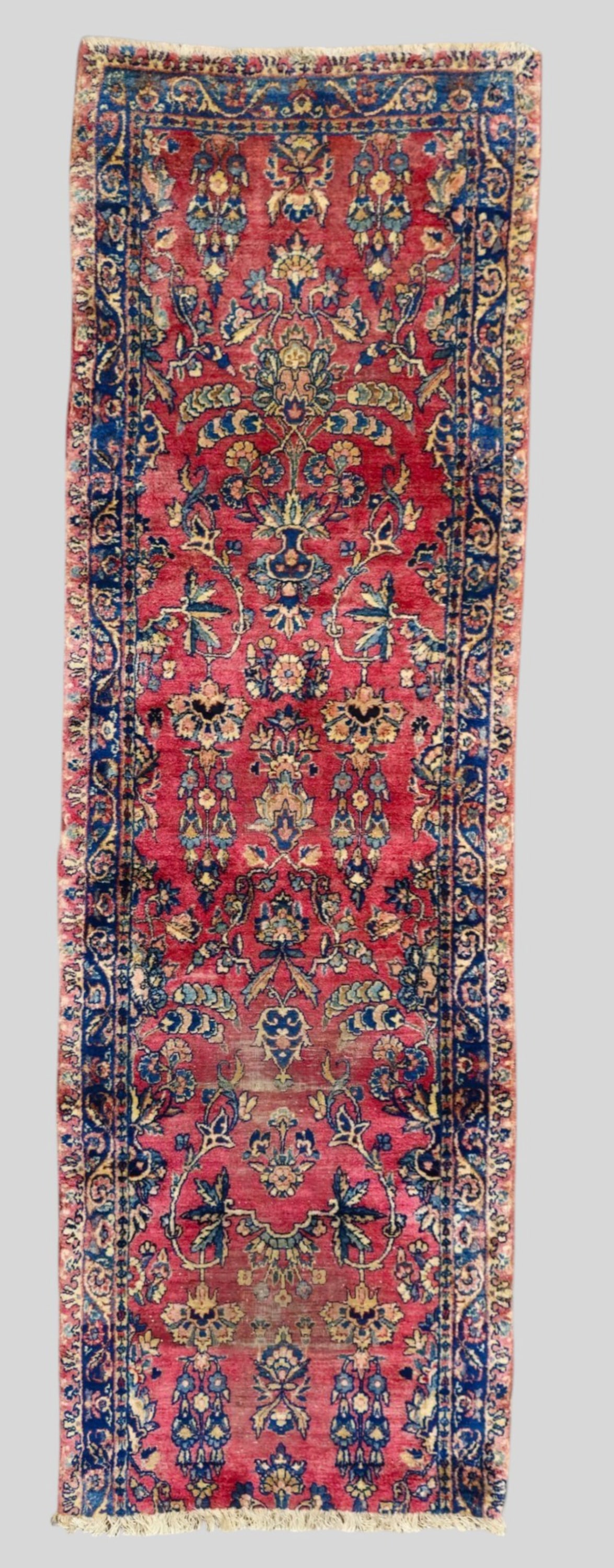 Sarouk Runner: Sarouk Runner 1960s. All over garden design over a red field. 2ft 7in x 8ft 2 1/2in.