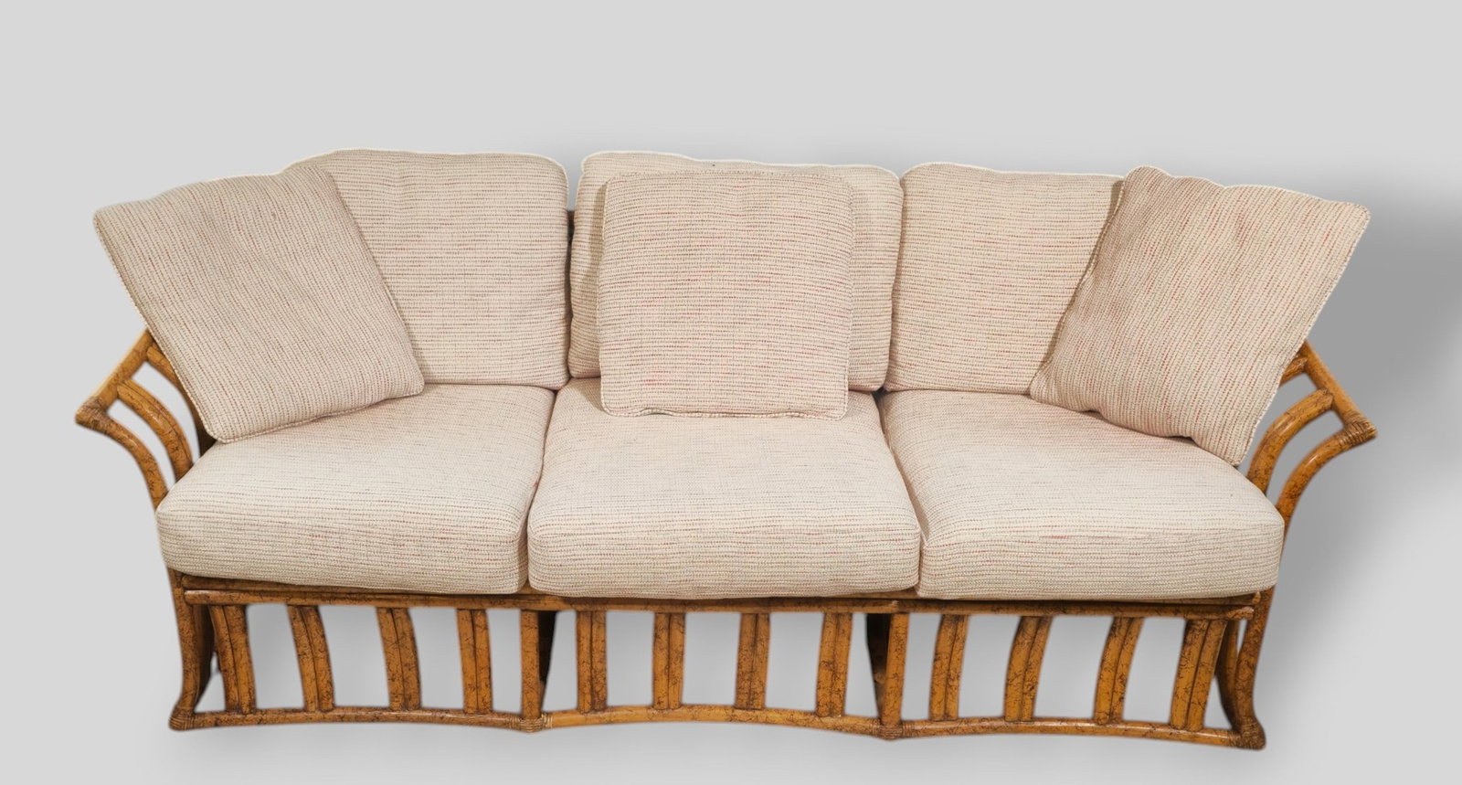Ficks Reed MCM Bamboo Sofa: Ficks Reed MCM Rattan Sofa. Ficks Reed Inc. USA. 1970s. Rattan and upholstery. 78w x 33 1/2d x 31h. SH-17 1/2h.