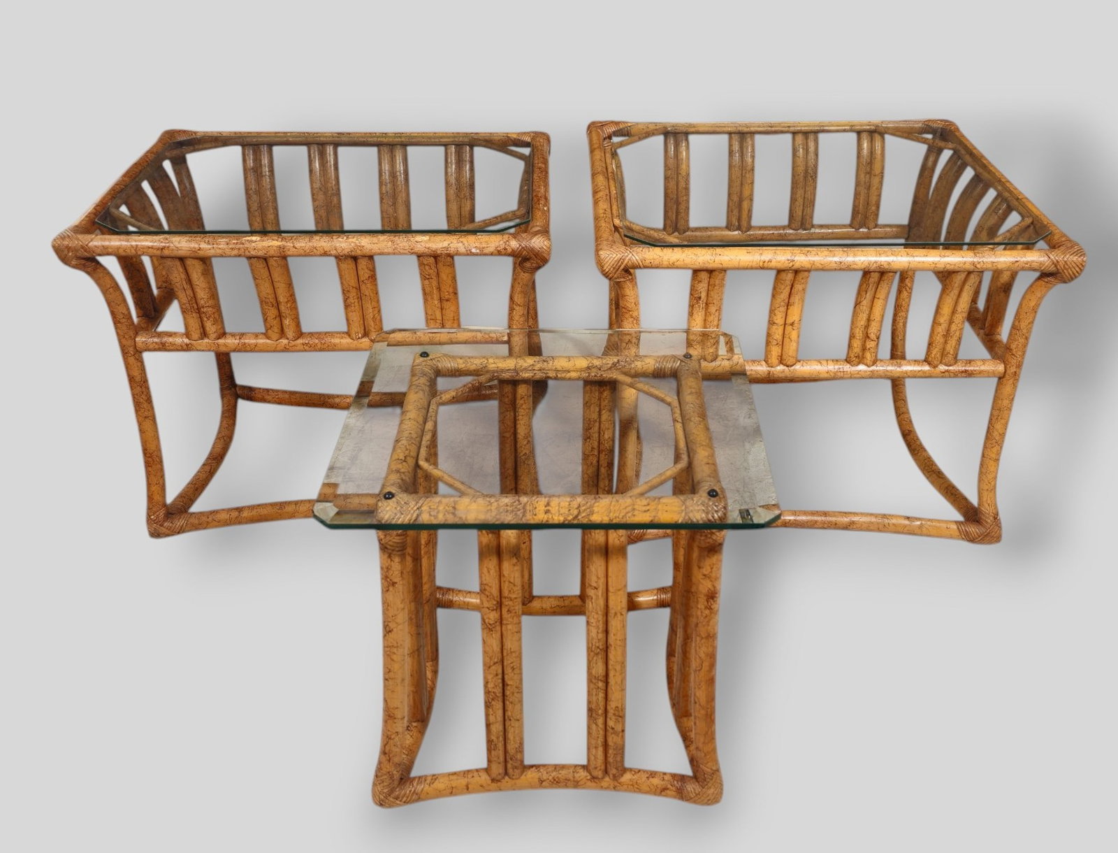 Ficks Reed MCM Bamboo Occasional Tables: Ficks Reed MCM Rattan Occasional Tables. Ficks Reed Inc. USA. 1970s. Rattan and glass. Largest - 28 3/4w x 28 3/4d x 21 1/2h. Mid - 23 1/2w x 28 1/2d x 21 1/2h. Small-20 1/4w x 20 1/4d x 18 1/2h.