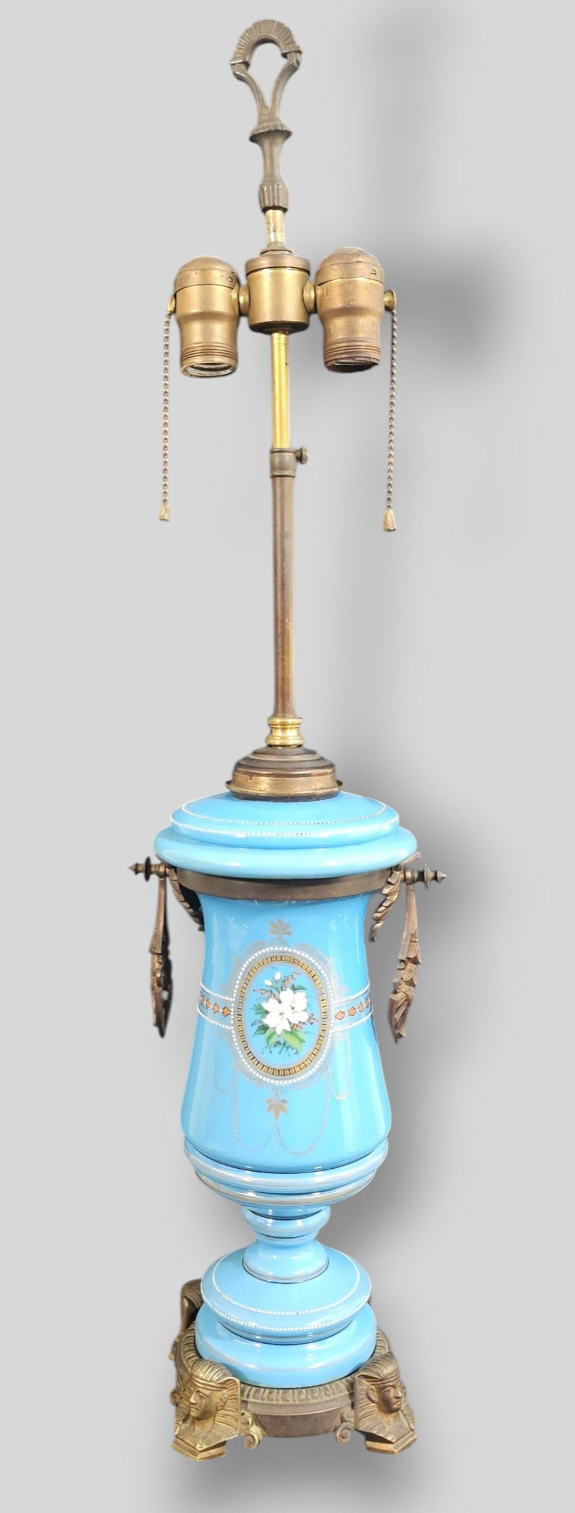 French Opaline Glass Table Lamp with Unusual Egyptian Pharoh Feet: French Opaline Glass Table Lamp with Unusual Egyptian Pharoh Feet.Gilt mHand painted enamel floral decoration and borders.etal bracket,base and handles. 7 1/2w x 6d x 31 1/4. Vase 13h.