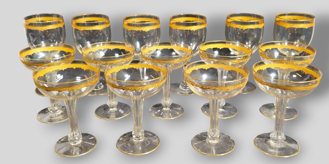 Tiffin-Franciscan Glassware with gilt and Gold Encrusted Borders: Tiffin-Franciscan Glassware with gilt and Gold Encrusted Borders. 15 glasses total. 6 water goblets 3 dia x 6 1/2h and 9 Champagne Glasses 3 3/4dia x 5 1/8h.