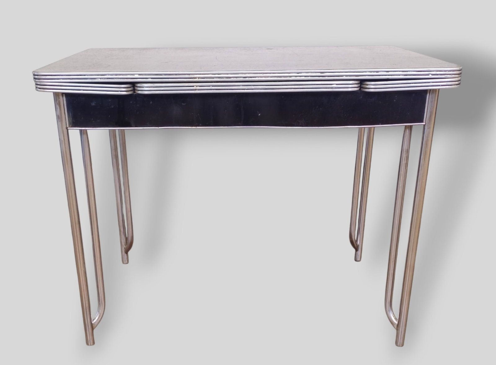 Wolfgang Hoffman Dining Table: Wolfgang Hoffman Dining Table. Howel Manufacturing Co. 1934. Chrome plated metal and laminate. 58w x 26 1/8d x 30 1/2h. Closed - 40w.