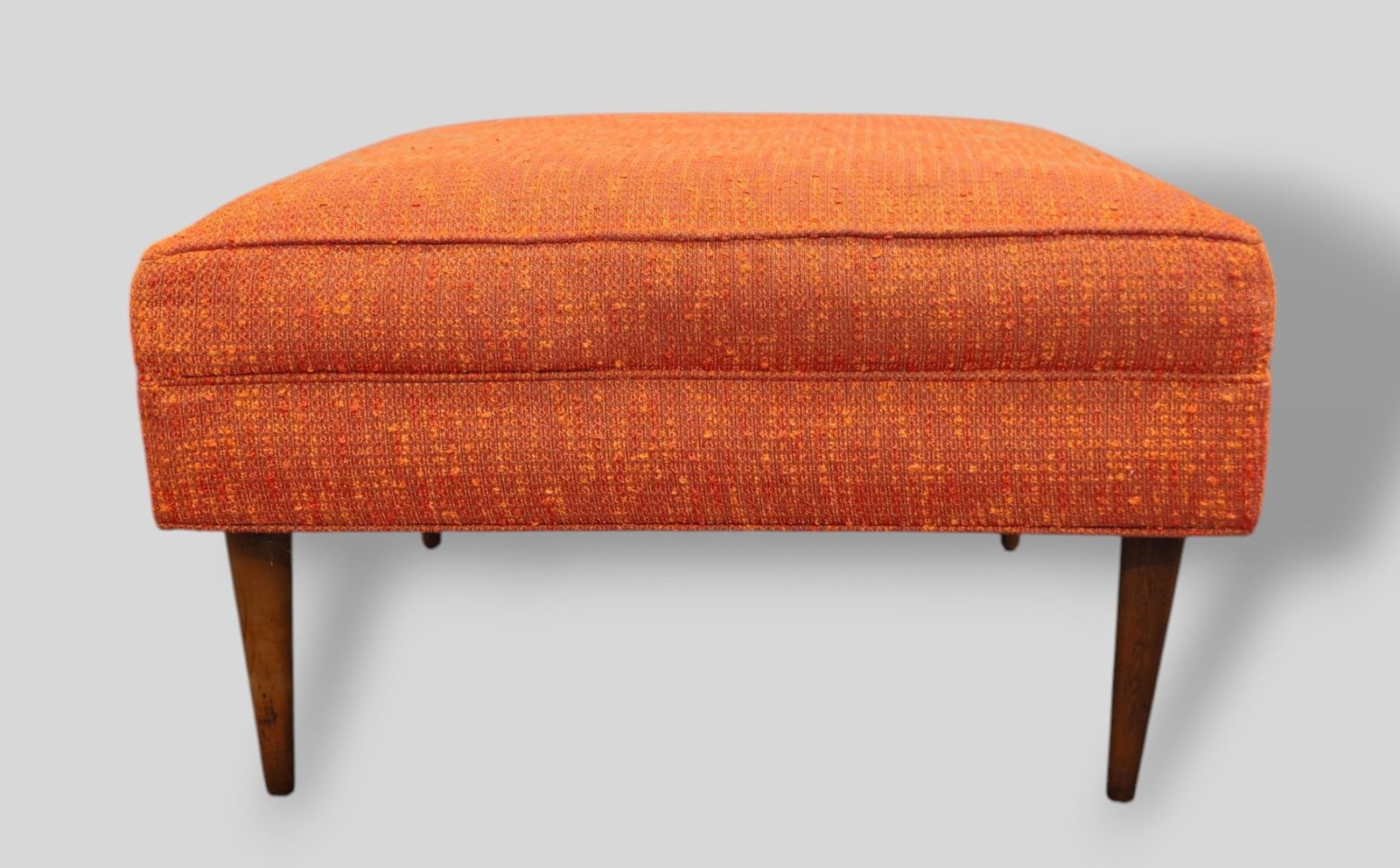 MCM Ottoman: MCM Ottoman. USA, 1960's. Walnut and upholstery. 26w x 26d x 15h.
