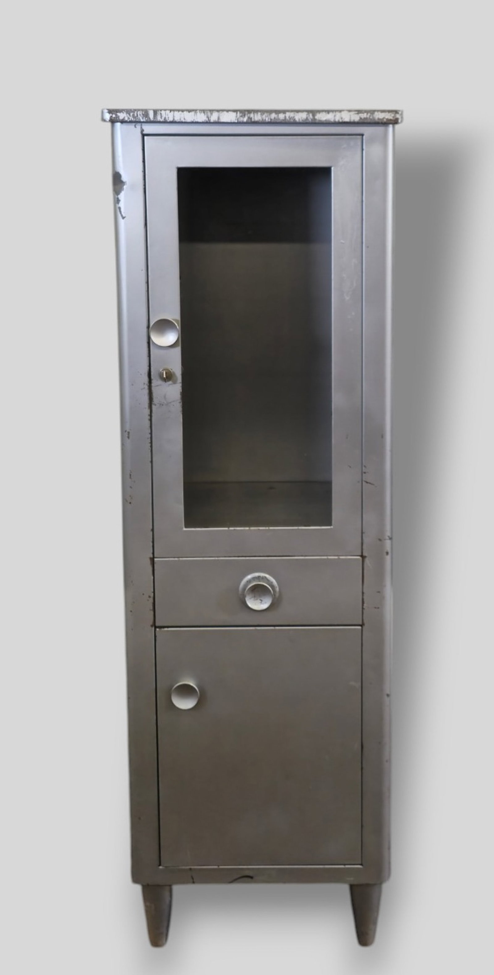 Norman Bel Geddes Medicine Cabinet: Norman Bel Geddes Medicine Cabinet. Simmons Furniture. USA. 1950. Enameled metal, Chrome platel steel and glass. 19 1/2w x 15 3/4d x 60 3/8h.