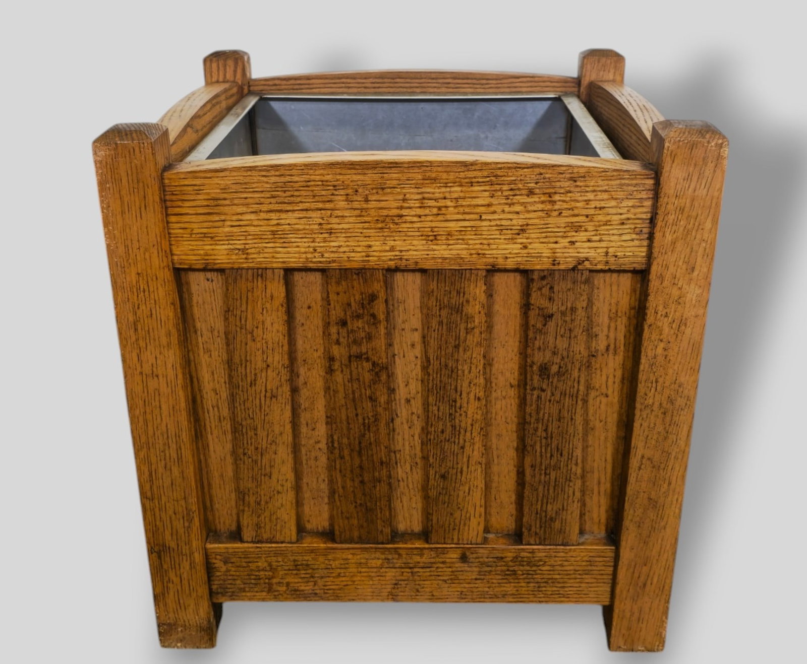 Arts & Crafts Oak Planter: Arts & Crafts Oak Planter. USA. 1940s. Four slat sides, beveled edges and original liner. 20w x 20d x 19 1/2h.