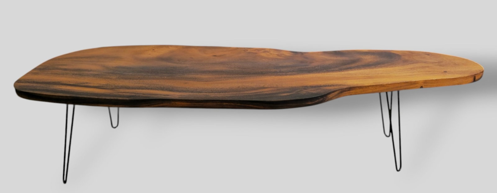 MCM Hawaiin Free Form Coffee Table: MCM Hawaiin Free Form Coffee Table. USA, 1970s. Kua wood and metal. 79 3/4w x 25 1/4d x 18 1/2h.