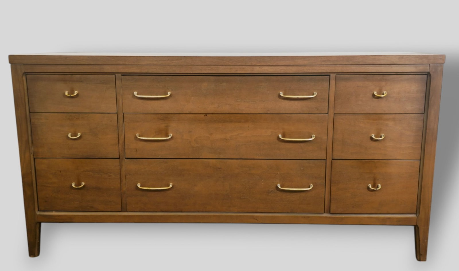 Broyhill MCM Forward Line Dresser: Broyhill MCM Forward Line Dresser . USA. 1960. Walnut and brass plated metal. Cabinet features 6 drawers. 601/4w x 19d x 30 1/4h