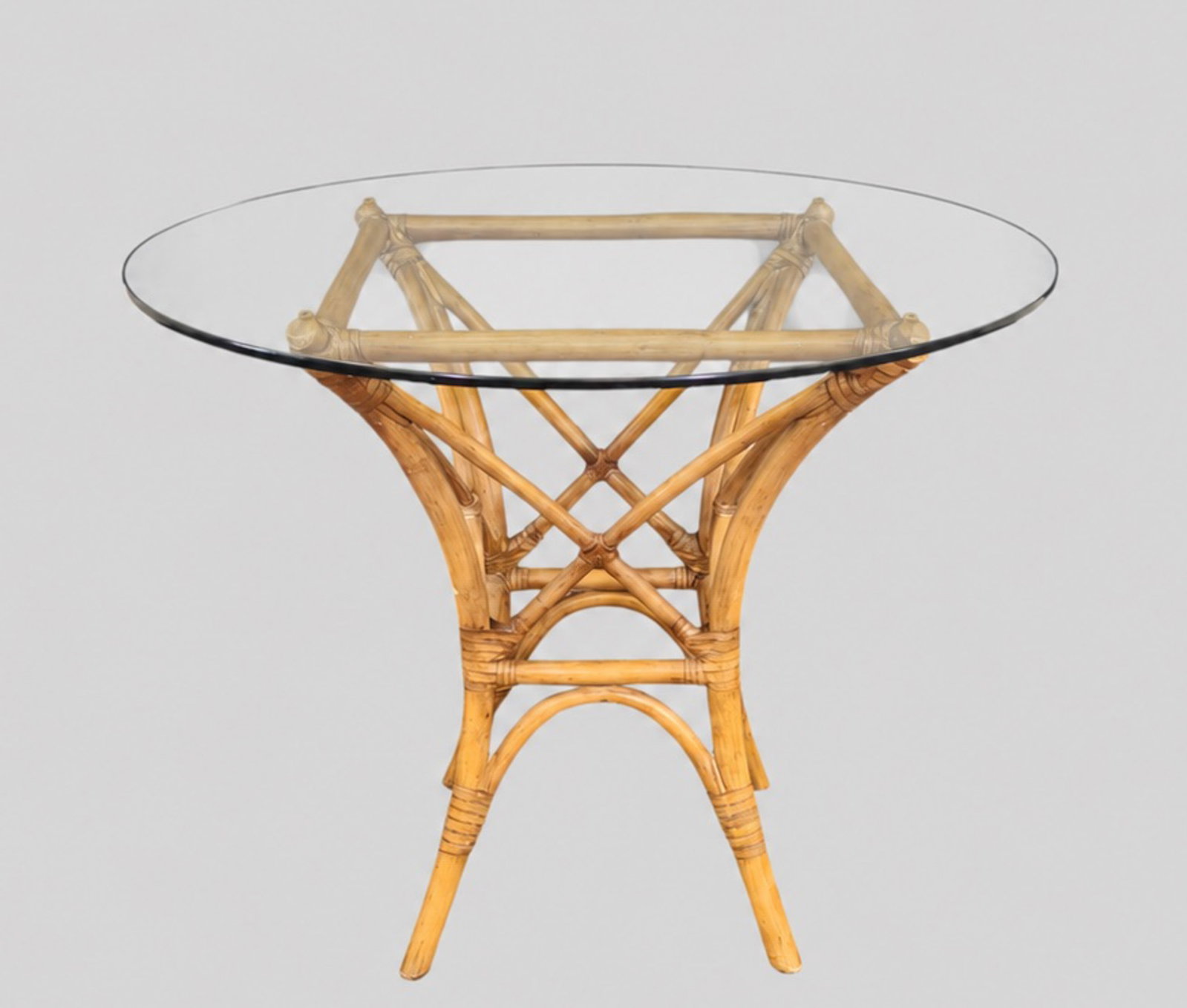 McGuire Laced Rawhide Rattan Glass Top Dining Table: McGuire Laced Rawhide Rattan Glass Top Dining Table. USA, 1970s. 36 dia x 29 3/4h.