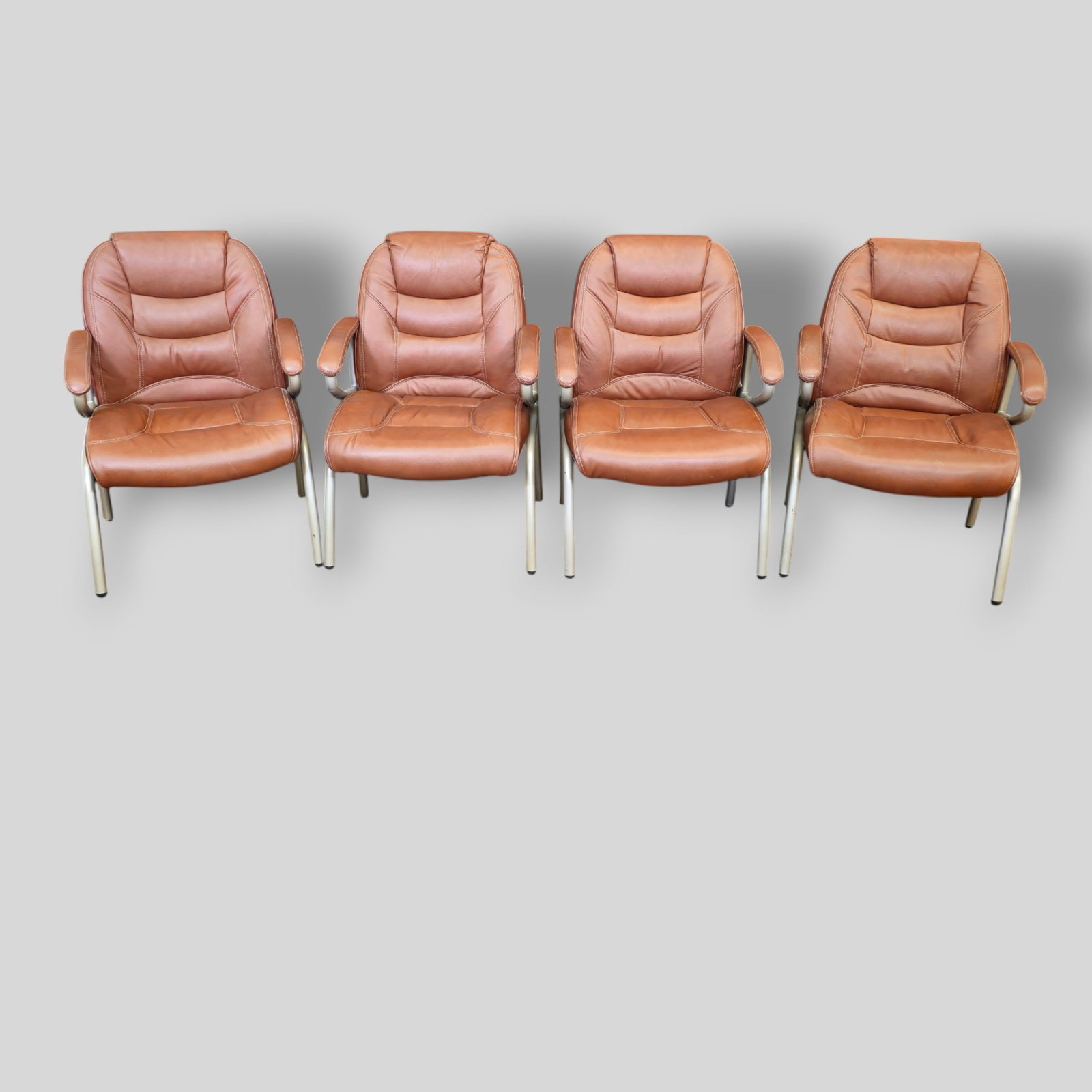 MCM Leather and Chrome Plated Steel Lounge Chairs: MCM Leather and Chrome Plated Steel Lounge Chairs. Set of 4. Laine. Manufacturer's label to chair. Leather and chrome plated steel. 26w x 24d x 35h. Sh-17 1/2.