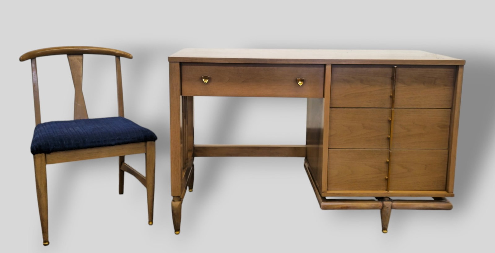 Kent Coffey The Sequence MCM Desk and Chair: Kent Coffey The Sequence MCM Desk and Chair. USA. 1950's. Desk features floating top and 4 drawers with sculptured pulls. Manufacturer's mark to drawer. Walnut and brass. 48w x 22d x 30 1/2.