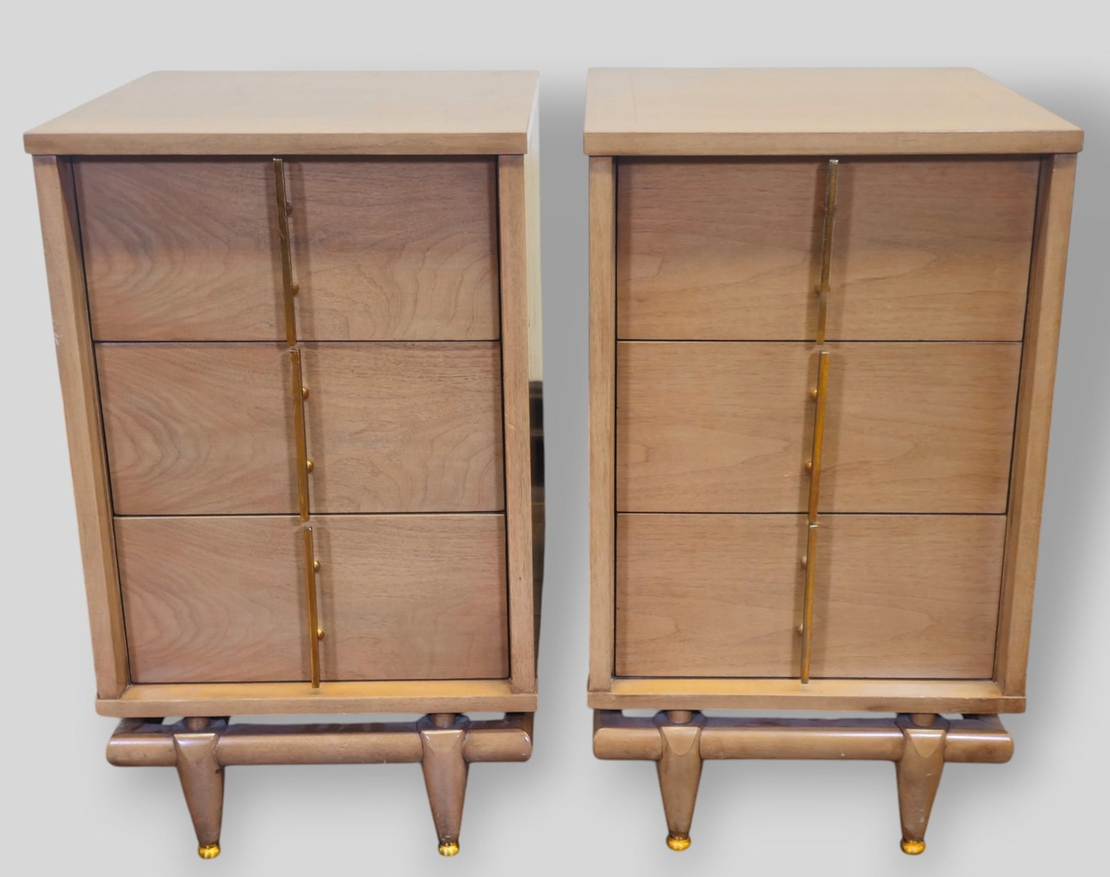 Kent Coffey The Sequence MCM Nightstands Pair: Kent Coffey The Sequence MCM Nightstands. Pair. USA. 1950's. Nightstand feature 3 drawers over a floating base raised on legs. Walnut and Sculptured brass pulls. Manufacturer's mark to drawer. 36w x