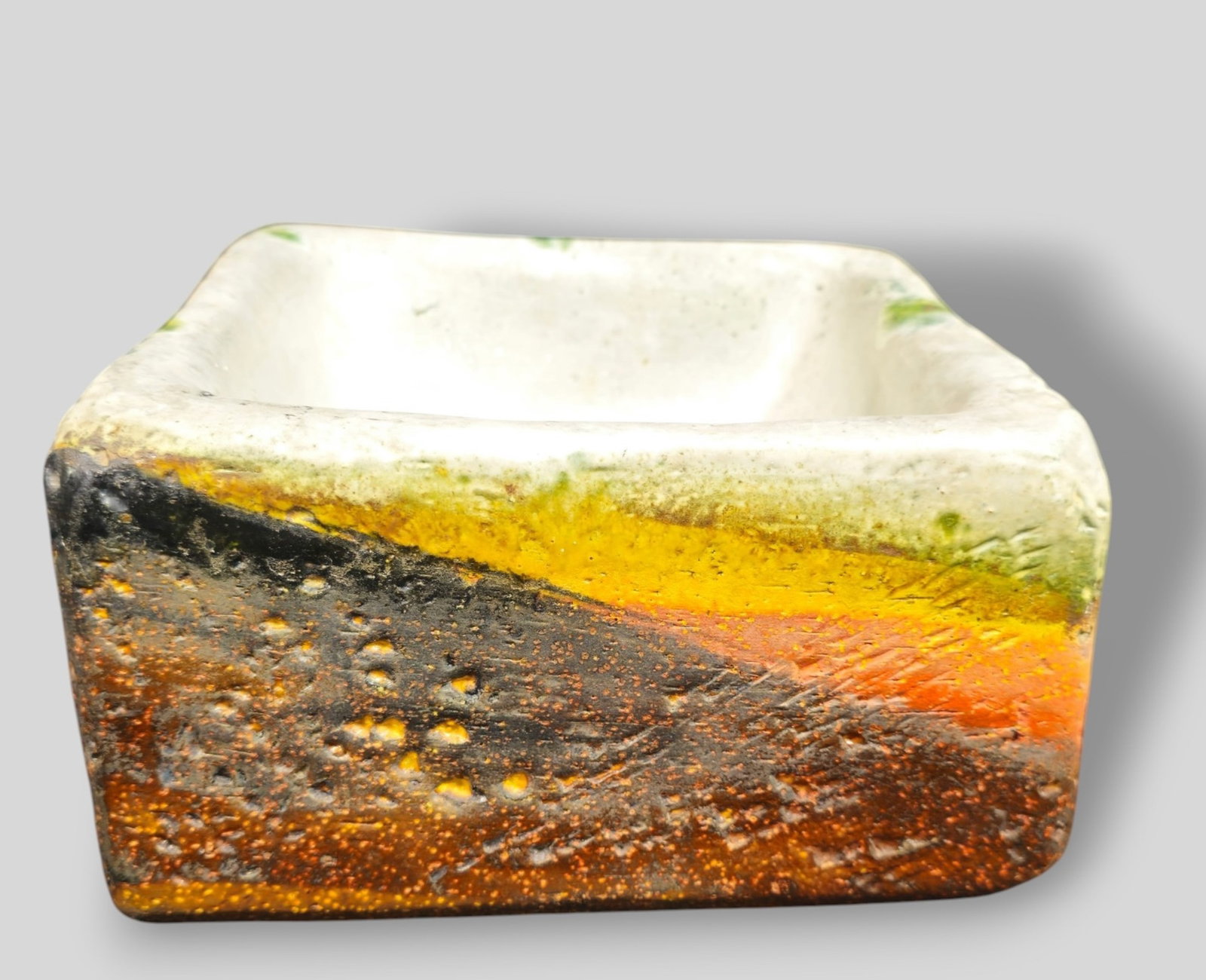 Marcello Fantoni Volcanic Glazed Earthenware Squared Bowl: Marcello Fantoni Raymor Volcanic Glazed Earthenware Squared Bowl. Italy. 1955. Signed to underside. Provenance: The Jonas Meyer Karp, Cincinnati, Ohio. 8 3/4w x 8 3/4d x 4 3/4h.
