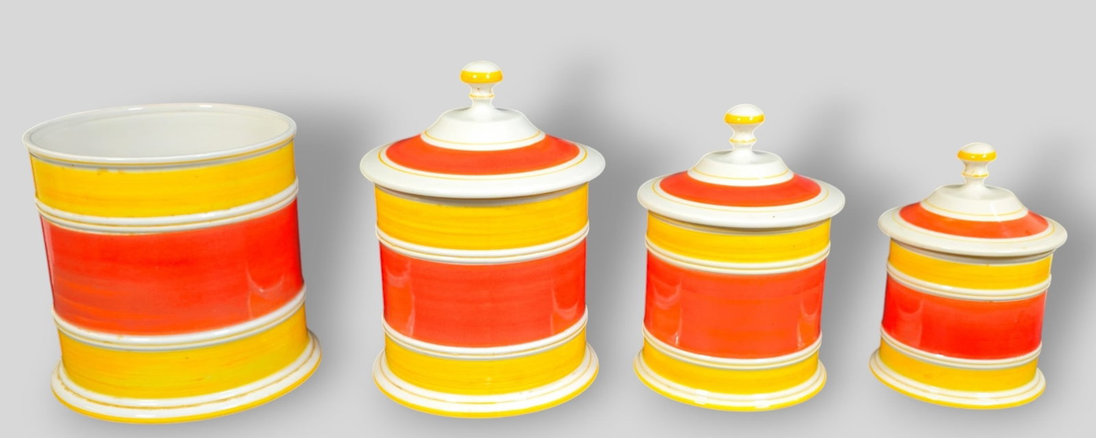 Mancer Italian Pottery Cannister Set: Mancer Italian Pottery Cannister Set. 1970. 3 cannister and lids and 1 large cannister. Largest complete cannister 6 dia x 8 1/2h.