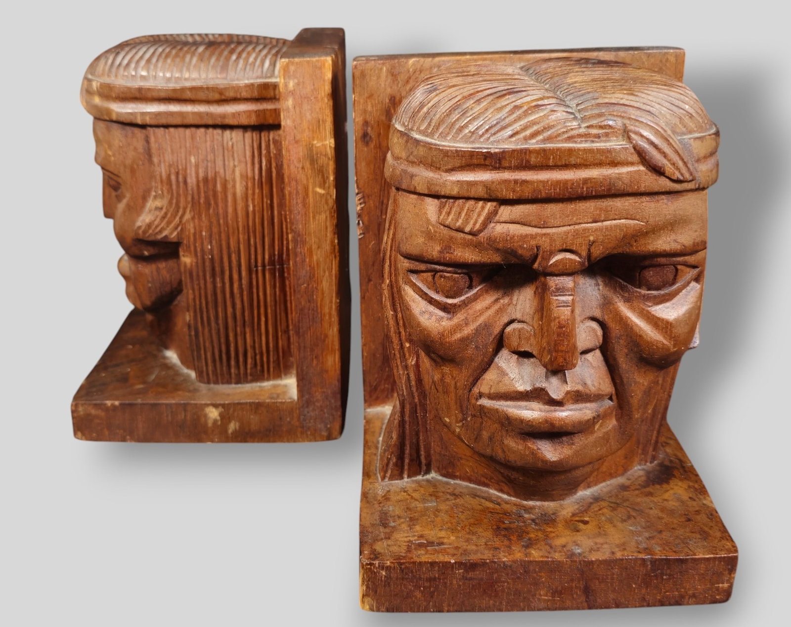 MCM Carved Head Bookends: MCM Carved Head Bookends. USA. 1970. Oak. 5 3/4w x 5 3/4d x 8h.