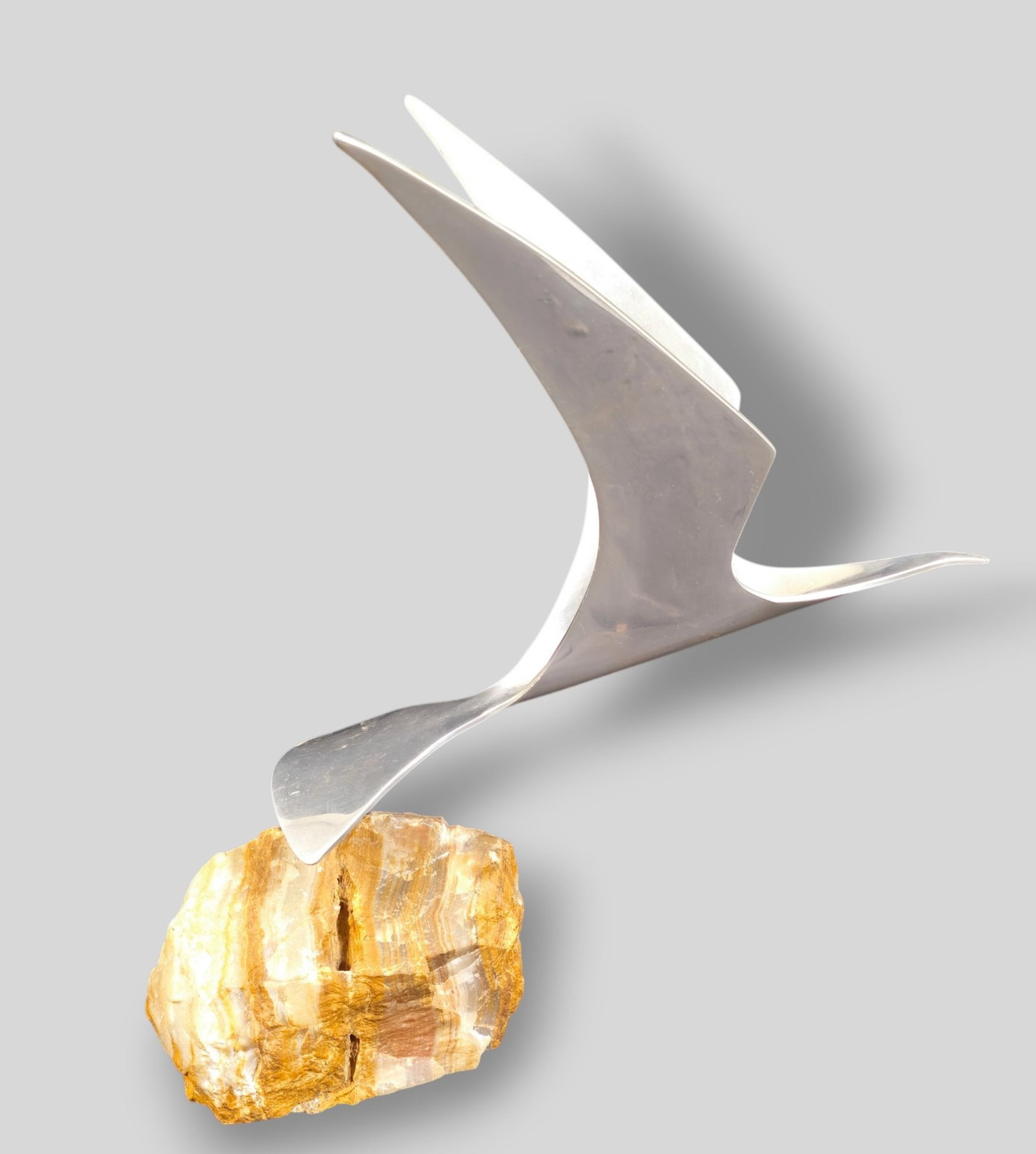 Curtis Jere Bird in Flight Sculpture: Curtis Jere Bird in Flight Sculpture. USA. 1970. Polished aluminum and stone. 11w x 12 1/2d x 13 1/2h