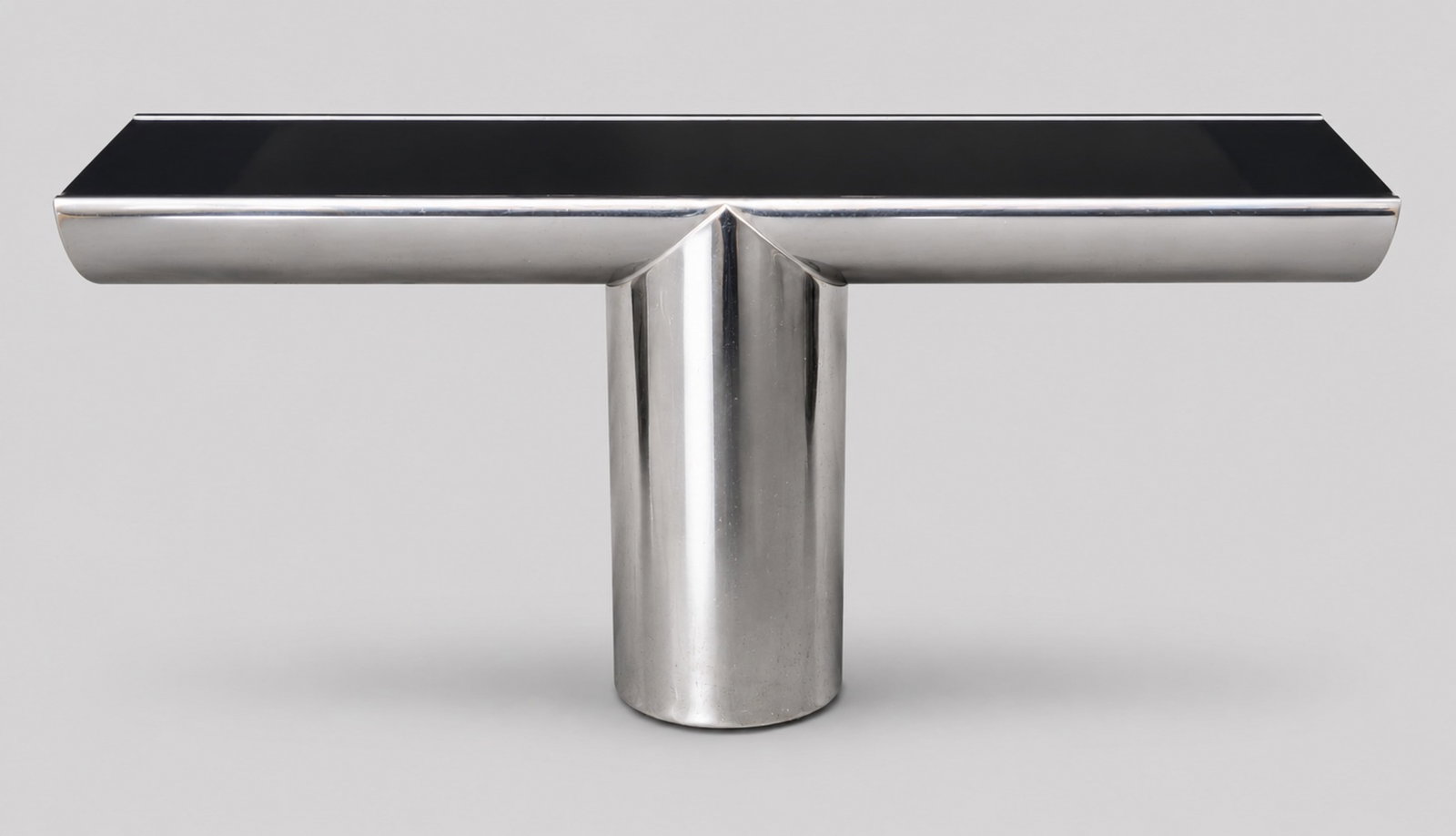 J Wade Beam Tee Table: J Wade Beam Tee Table. Brueton. USA. 1985. Stainless steel and vitrolite. 60W x 18d x 30 1/2h.