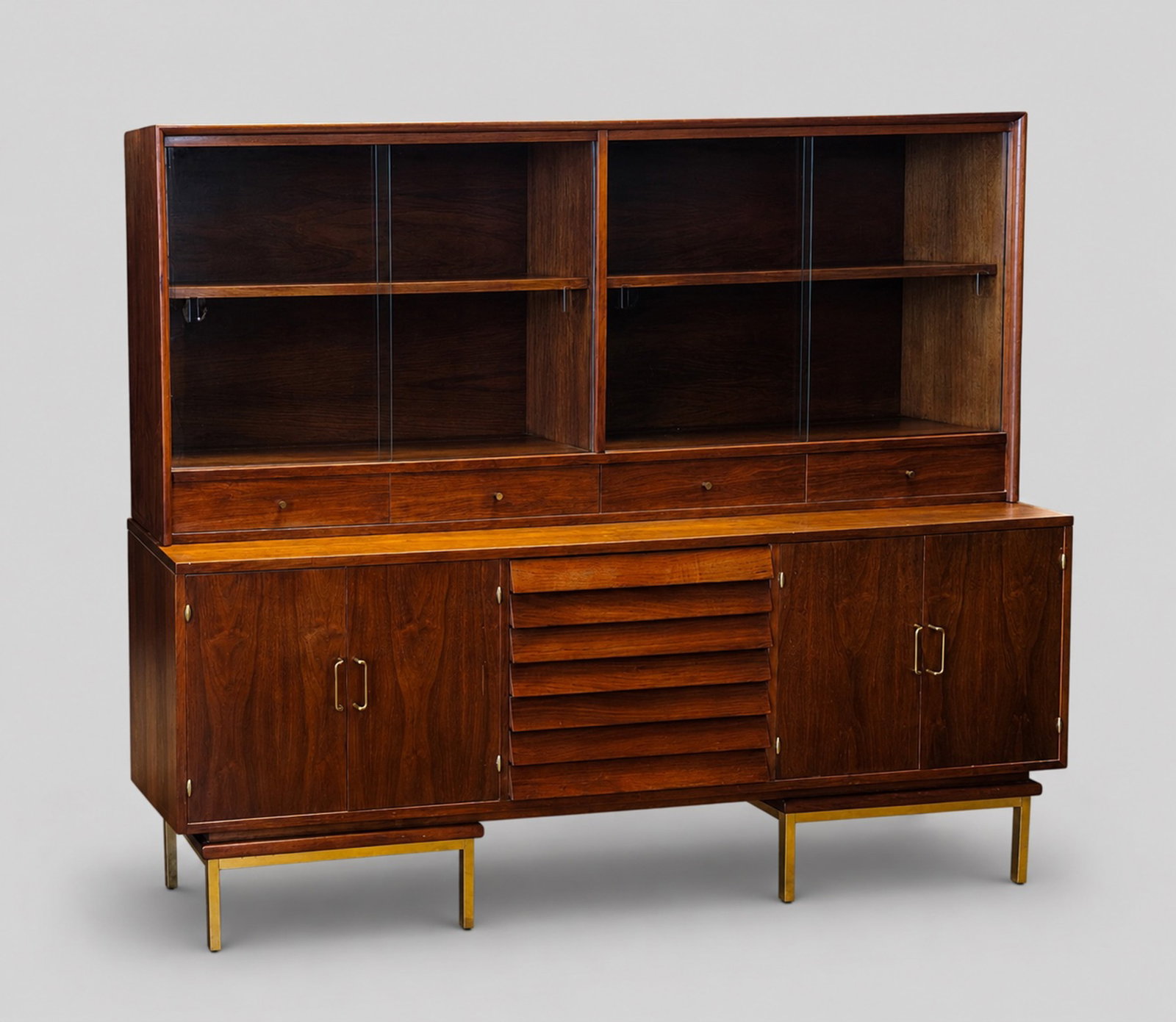 Merton Gershun Credenza with Display Top: Merton Gershun Credenza with Display Top. American of Martinsville. USA. 1955. W61 1/2h.alnut, brass and glass. 78 1/4w x 18 1/2d x