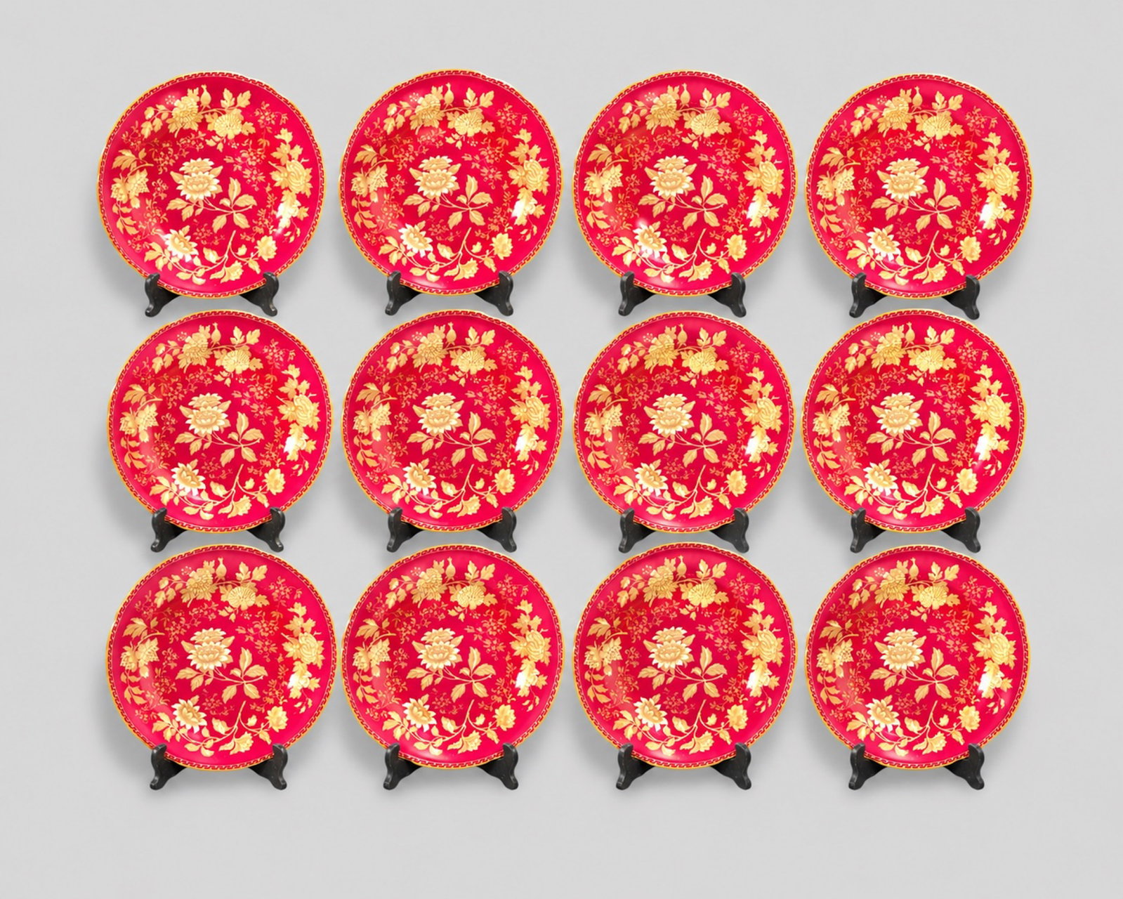 Wedgwood Tonquin Ruby Red Porcelain Plates: Wedgwood Tonquin Ruby Red Porcelain Plates. Set of 12. Gilt borders. Manufacturer's marks to underside. 11dia.
