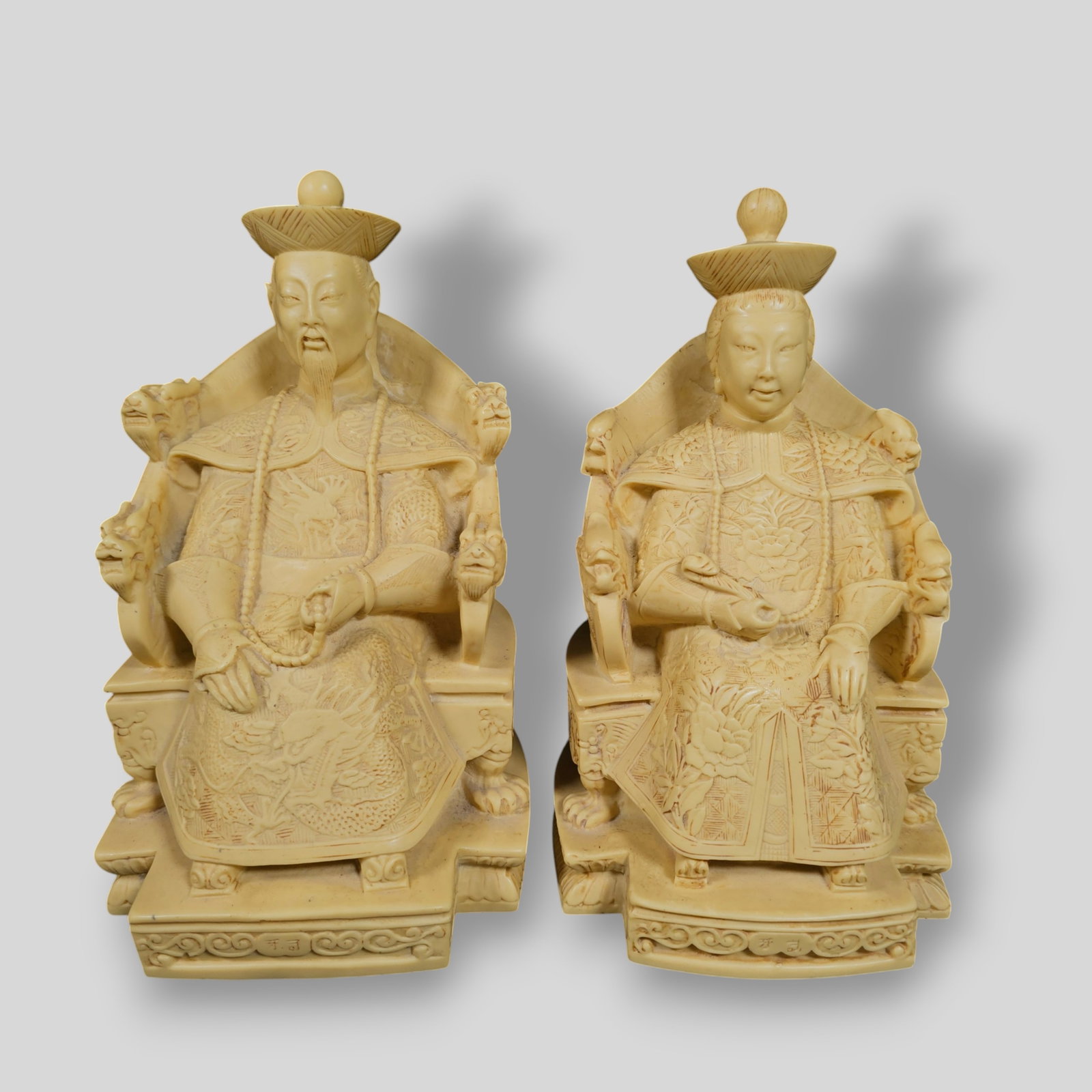 Chinese Cast Resin Emperor and Empress Bookends: Chinese Cast Resin Emperor and Empress Bookends. 5 1/2w x 6d x 10 1/4h.