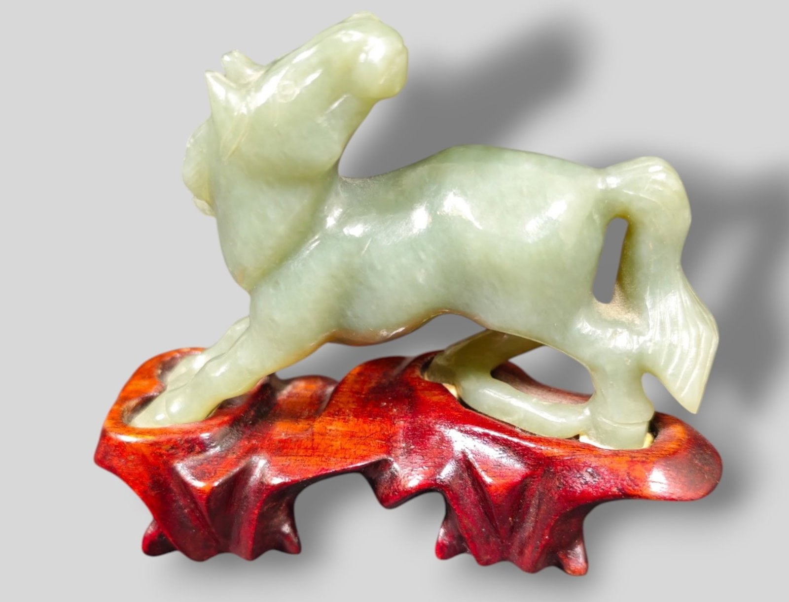 Chinese Carved Jade Horse: Chinese Carved Jade Horse. Custom fitted teak stand. Horse 3 1/4w x 1d x 2 1/2h.