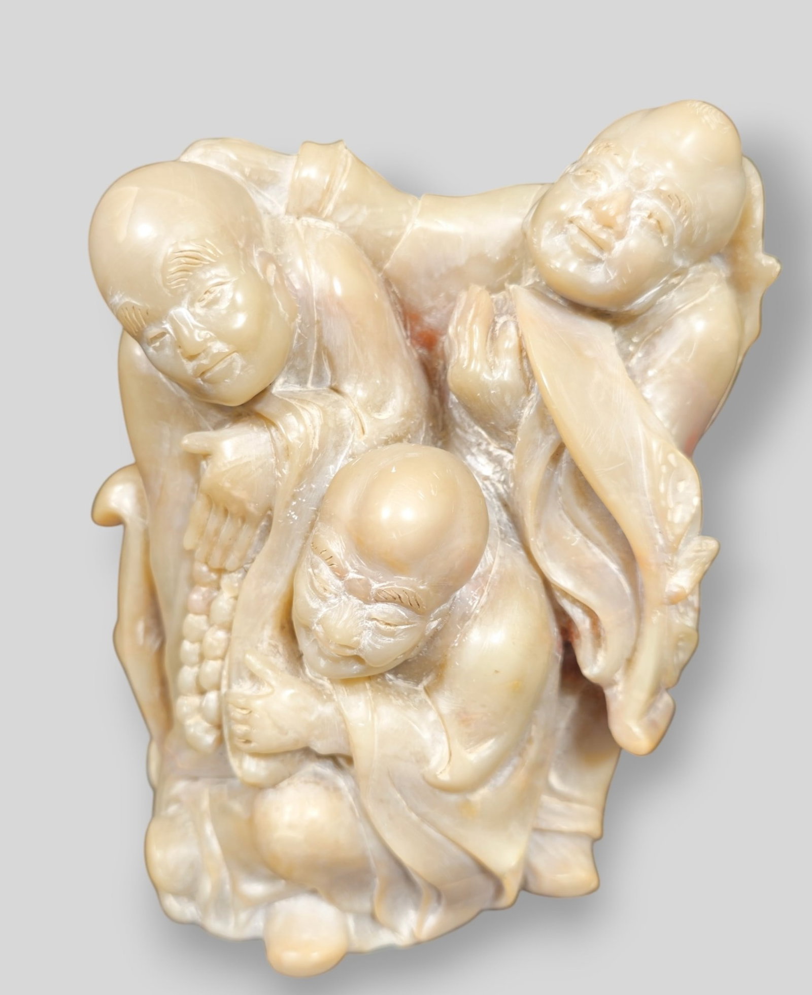 Chinese Hard Stone Luohans: Chinese Hard Stone Luohans. Three Luohans dressed in robes in one sculpture. 4 1/4w x 2 1/2d x 5 7/8h.