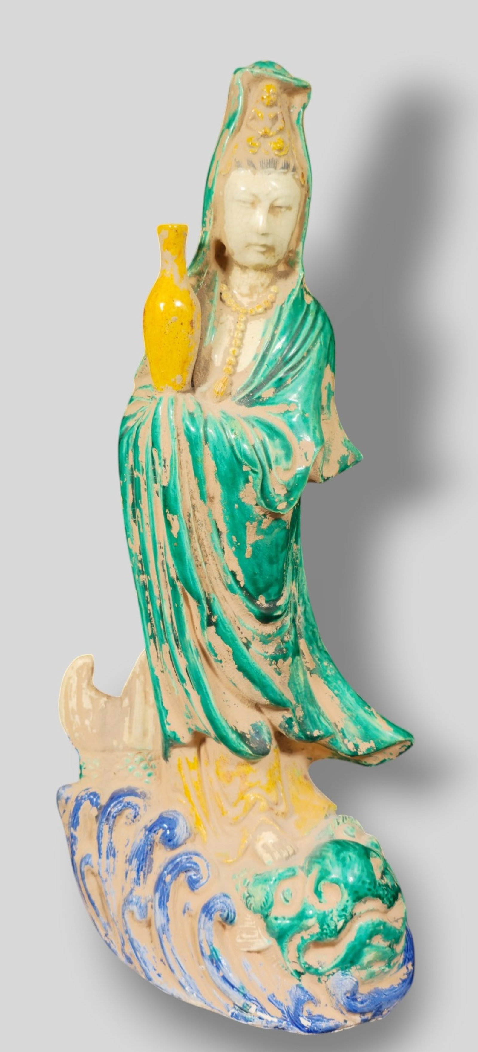 Chinese Guan Yin: Chinese Guan Yin . Late 19th Century. She is holding a water vessel. 9w x 5 1/2d x 18 1/4h.
