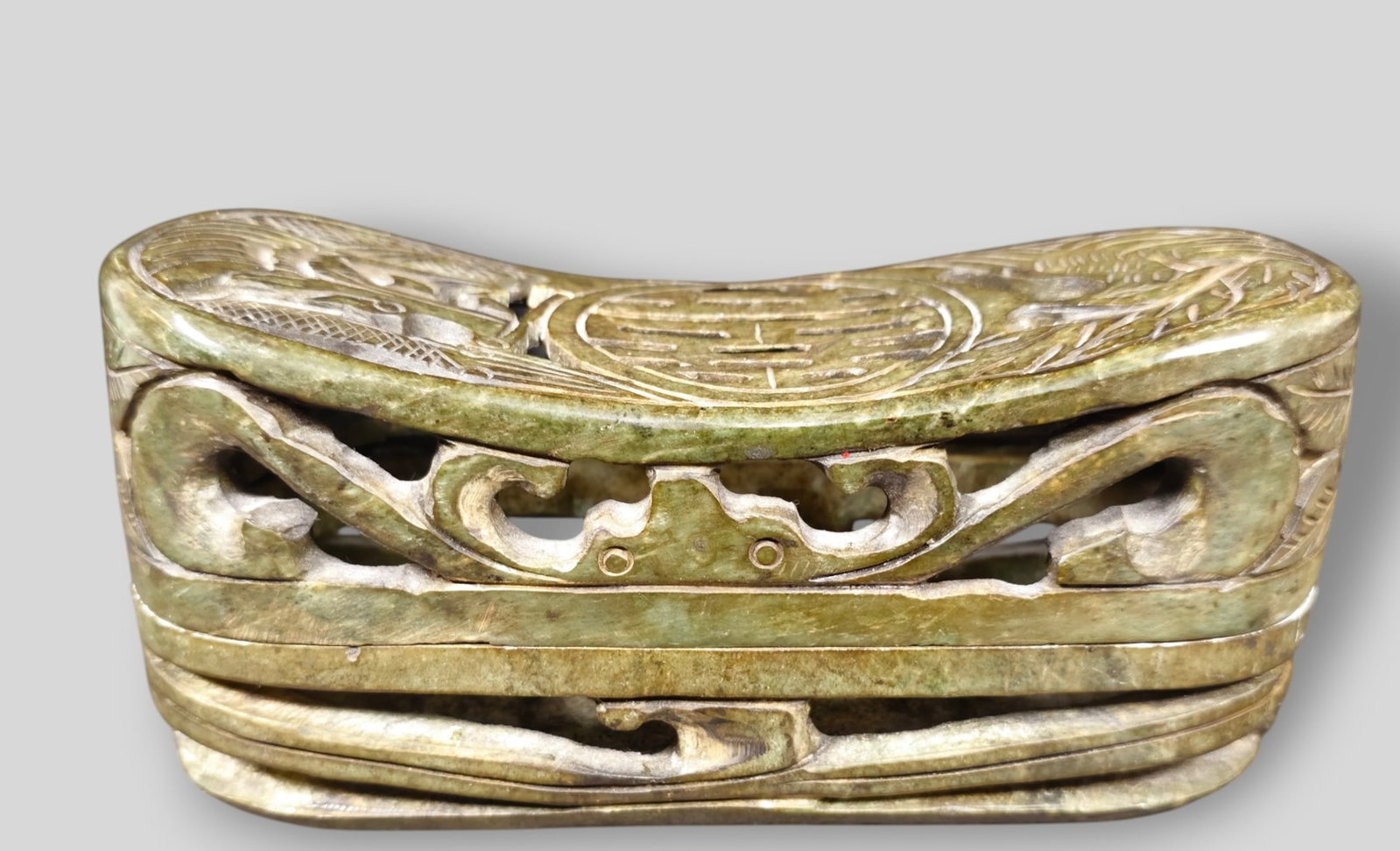 Chinese Archaic Carved Spinach Jade Pillow Box: Chinese Archaic Carved Spinach Jade Pillow Box. Oblong shaped decorated with carved phoenix and dragon. 8 1/4w x 3 1/4d x 3 3/4h.
