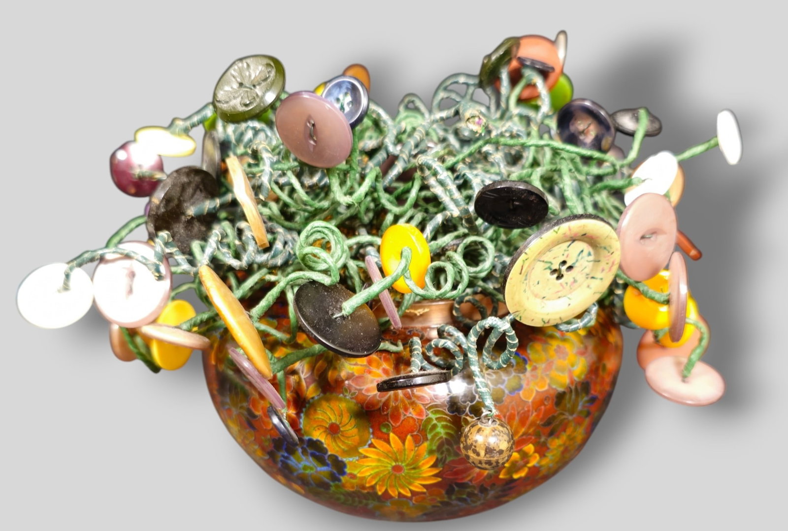 Chinese Cloisonne Floral Motif Vase with Button Sculpture: Chinese Cloisonne Floral Motif Vase with Button Sculpture. 20th Century. Button range 1920s to 1970s. 9 1/2w x 9 1/2d x 7 1/4.