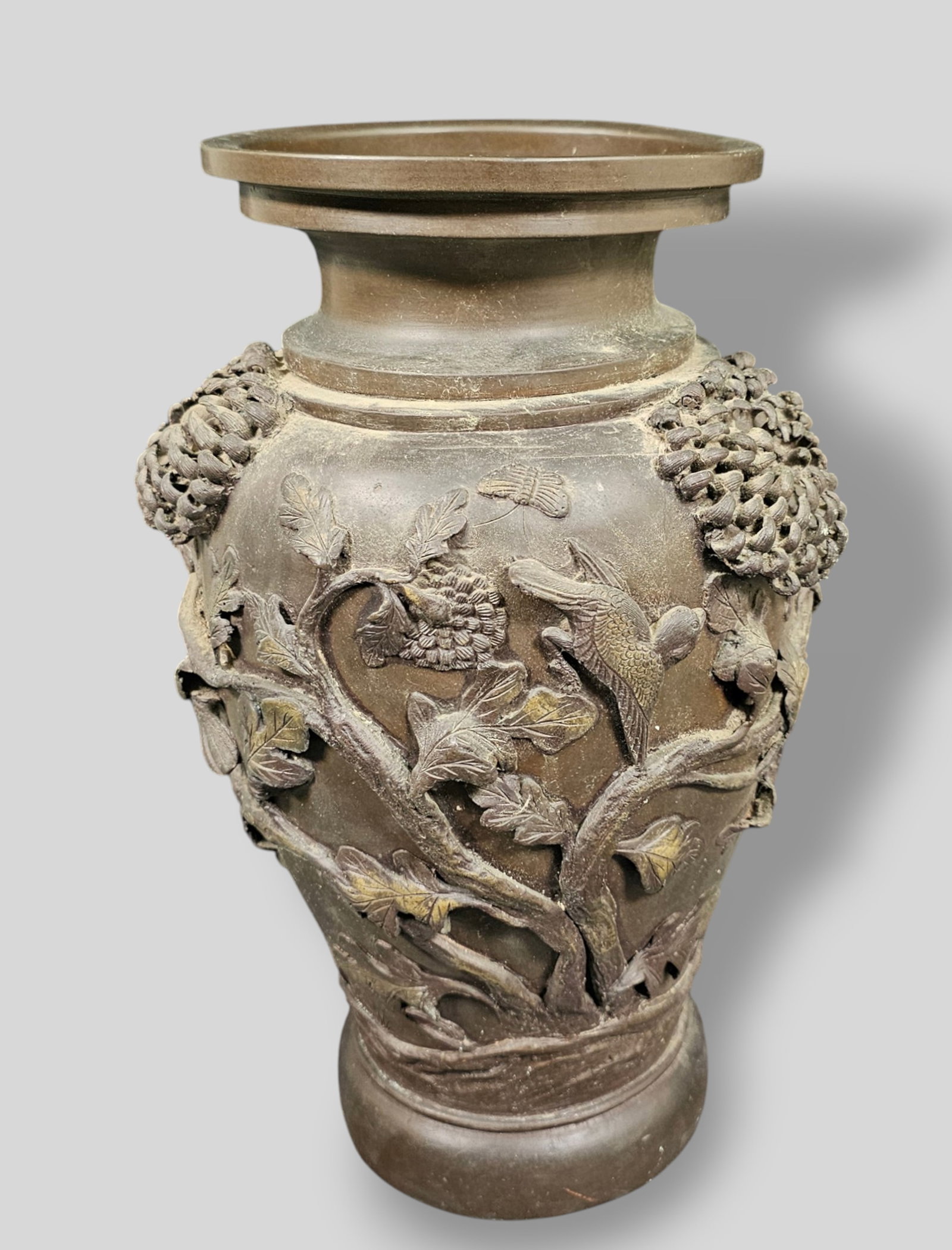 19th Century Meiji Period Bronze Vase: 19th Century Meiji Period Bronze Vase. Circa 1870-1880. High relief flowering branches with blooming Chrysanthemums, birds and butterflies. Traces of gilt. 9 1/2w x 9d x 14 1/2h.
