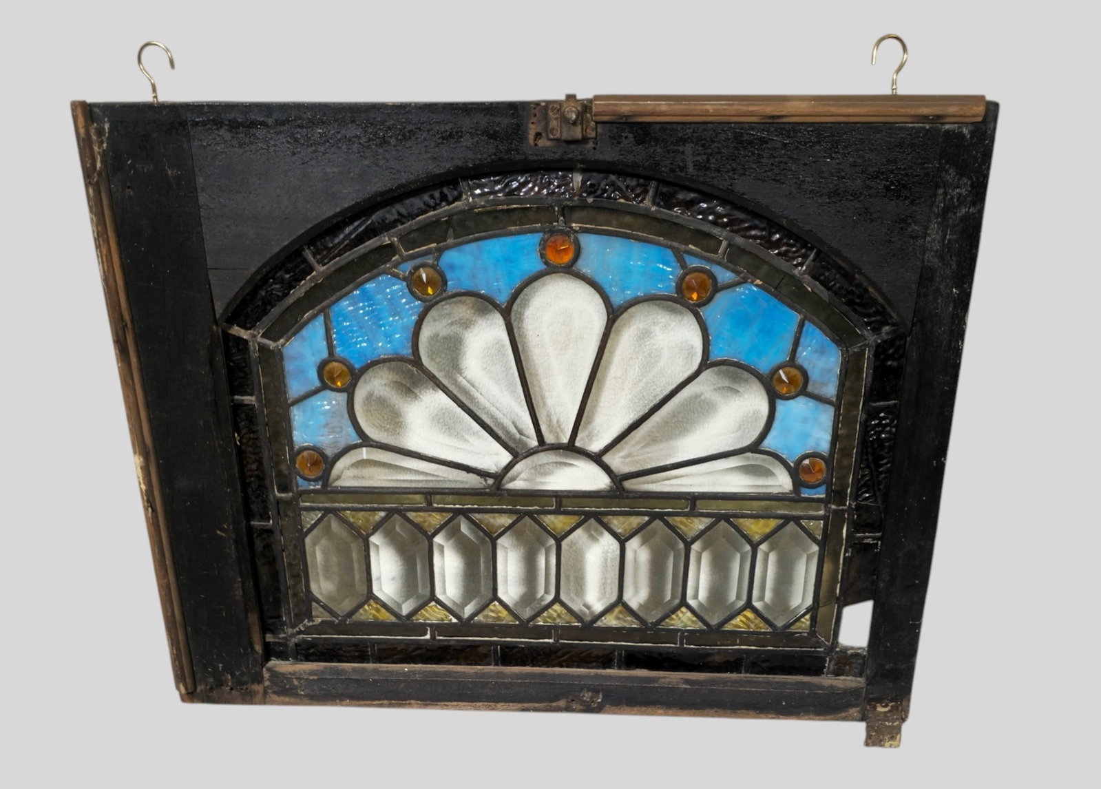 Stained Leaded and Jeweled Glass Window Circa 1890: Stained Leaded and Jeweled Glass Window Circa 1890. All stain glass window dimensions include the entire frame. 26 1/2w x 1d x 21h.