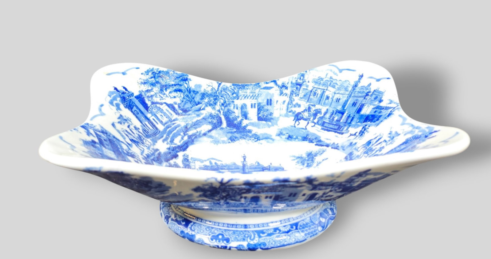 20th Century Blue and White Stoneware Serving Bowl: 20th Century Blue and White Stoneware Serving Bowl. Footed base and historical city scenes. 12 1/2w x 9 1/2d x 4 5/8h.
