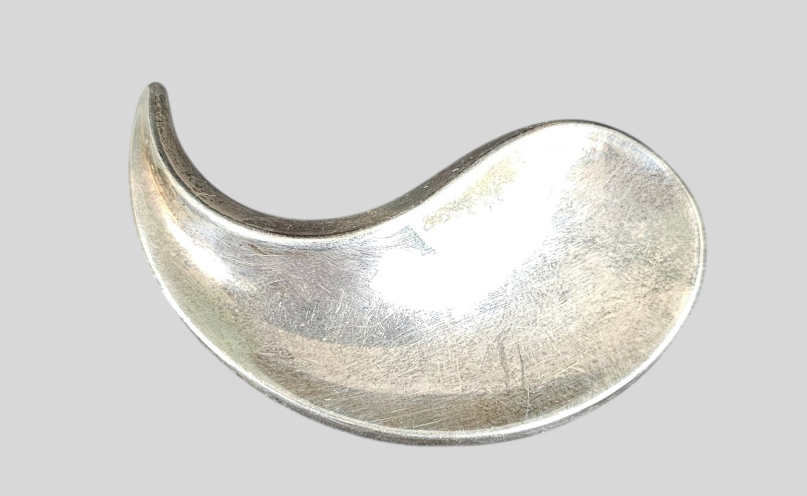 Karen Strand for Anton Michelson Sterling Silver Brooch: Karen Strand (1924-2000) for Anton Michelson Sterling Silver Brooch. Denmark. 1940s. Marked to underside; Michelson hallmark (AM), sterling, Denmark and Strand. Weight . 2 1/2w x 1 3/8h.