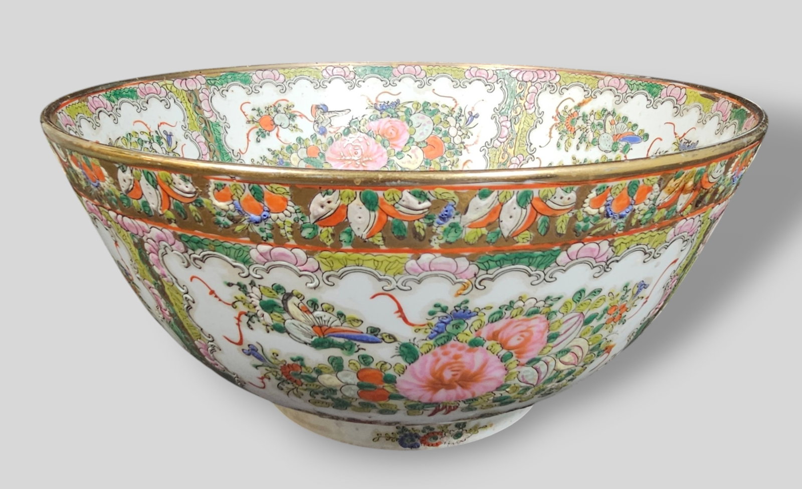 Chinese Famille Rose Porcelain Center Bowl: Chinese Famille Rose Porcelain Center Bowl. 20th Century. Decorated with floral motif and birds. Gilt borders. Signed with Jiaqing mark to underside. 12dia x 5 3/4h.