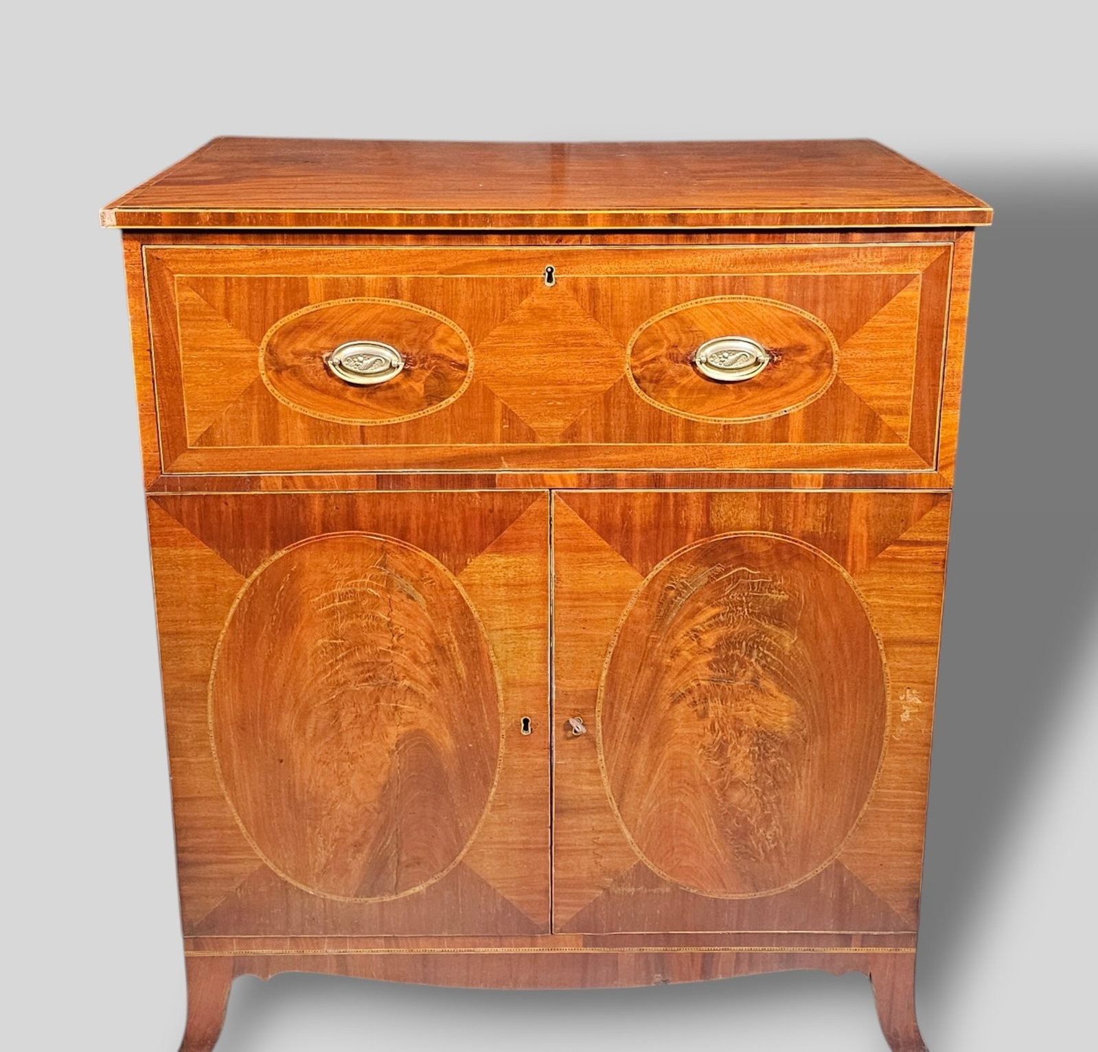 19th Century Federal Mahogany Inlaid Fall Front Desk: 19th Century Federal Mahogany Inlaid Fall Front Desk. String inlay border top over 1 drawer with fall front. Interior has 4 drawers, center door and 6 pigeon holes. Center has 2 interior drawers and