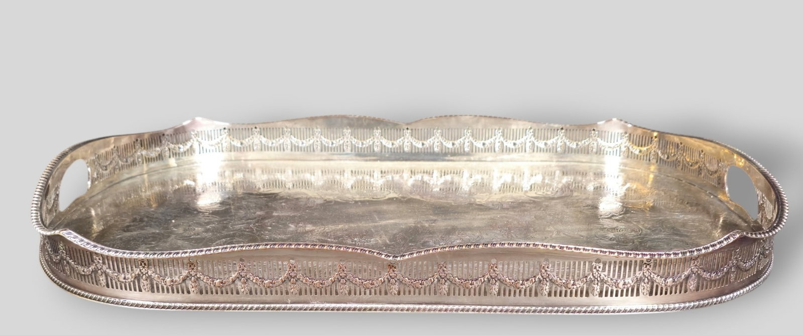 Edwardian Style Silver Plated Tray: Edwardian Style Silver Plated Tray. Scalloped gadroon border and engraved interior. Resting on ball feet. 22 3/8w x 14 3/4d x 2 3/4h