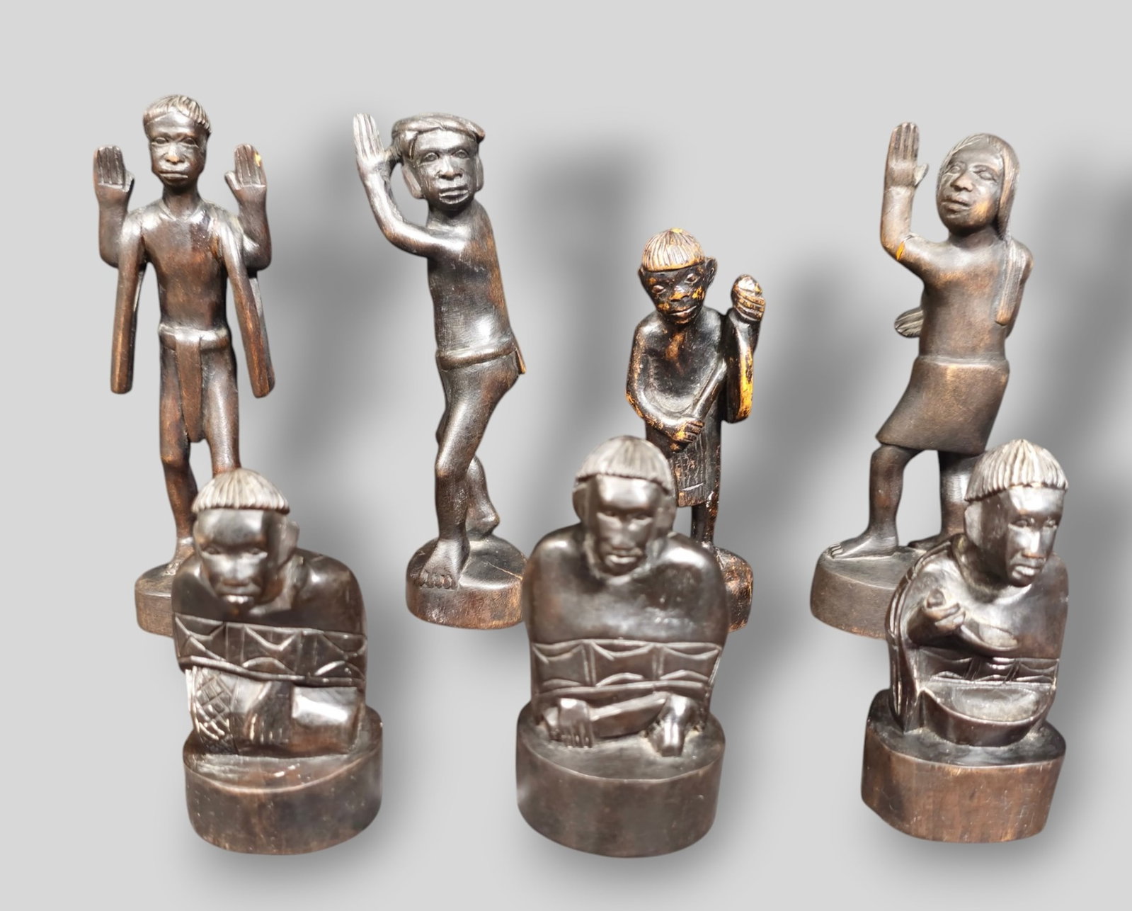 Assembled African Carved Cabinet Sculptures: Assembled African Carved Cabinet Sculptures. 8 Total. African Tribal statues. Carved Ebony. 1 3/4w x 1 5/8d x 5 5/8h.