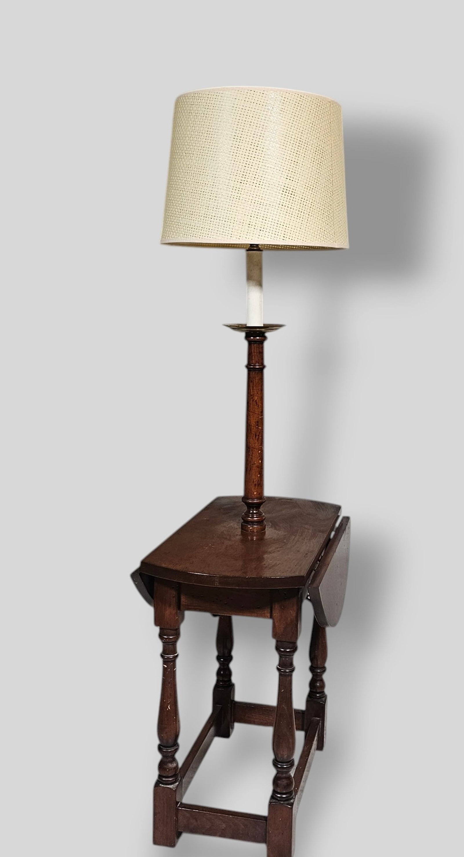 Drop Side Floor Lamp: Drop Side Floor Lamp. USA. 1960s. Turned shaft, legs and box stretcher. 13w x 22 1/4d x 53h. Open - 22 dia.