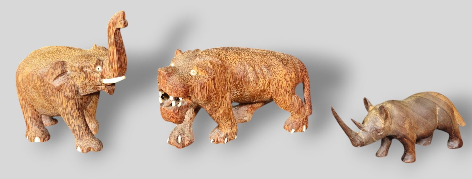 Assembled Carved Animals: Assembled Carved Animals. 3 total. Elephant, Rhino and lion. Elephant 5 3/4w x 2 3/4d x 6h.