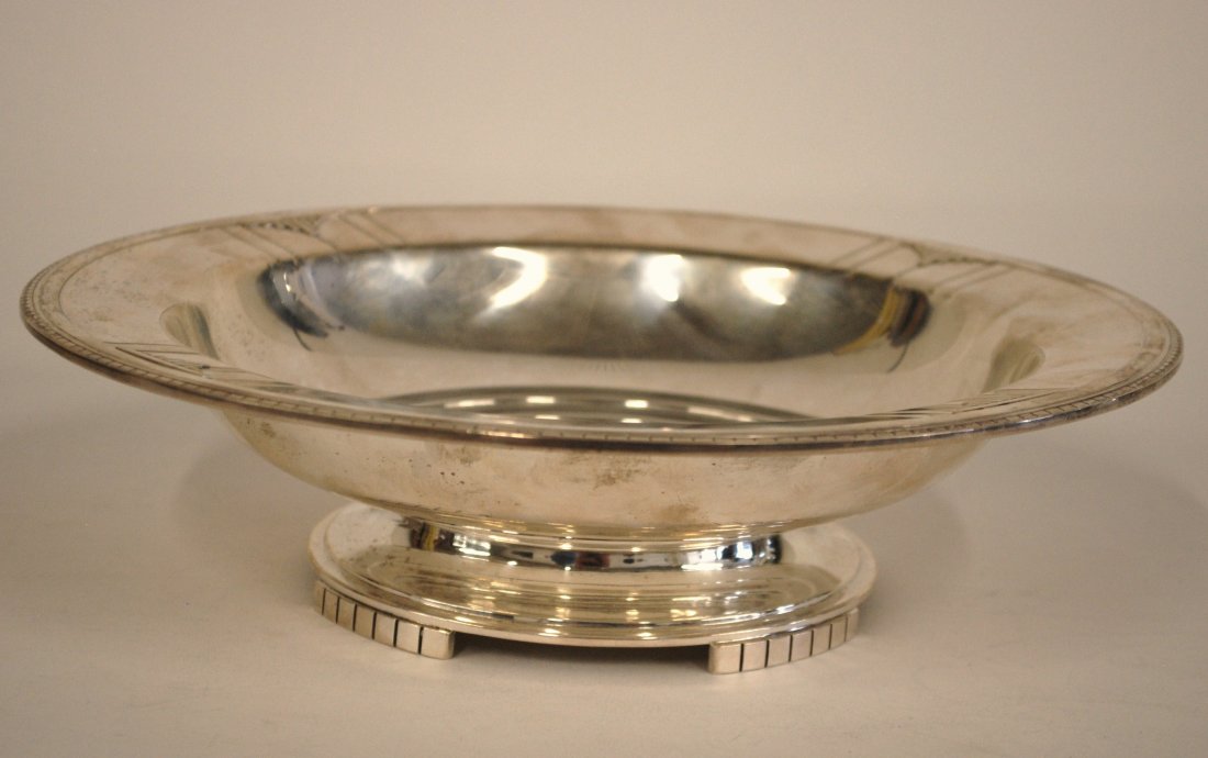 Wallace Sterling "Rhythm" Fruit Bowl: Fine and rare pattern. Art Deco fruit bowl with four feet, marked on base, "RW & S" with unicorn head, "Sterling 3909 Rhythm Wallace." 10.5" round, 17ozt