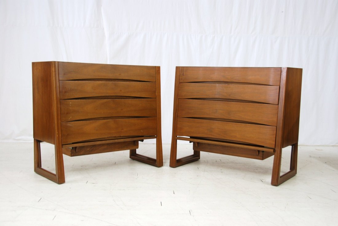 Harold Schwartz: Pair of Five drawer bedside chests, curved front, tapered sides, cutout drawers. MFG. by Romweber, M796 Walnut. 42W x 20D x 38H